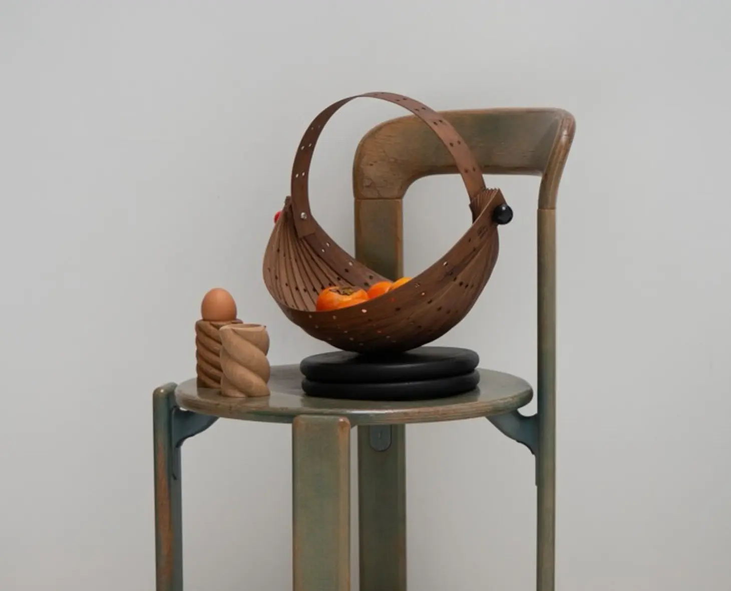 OROS Zarucolander on a chair with the tornado add cups next to it