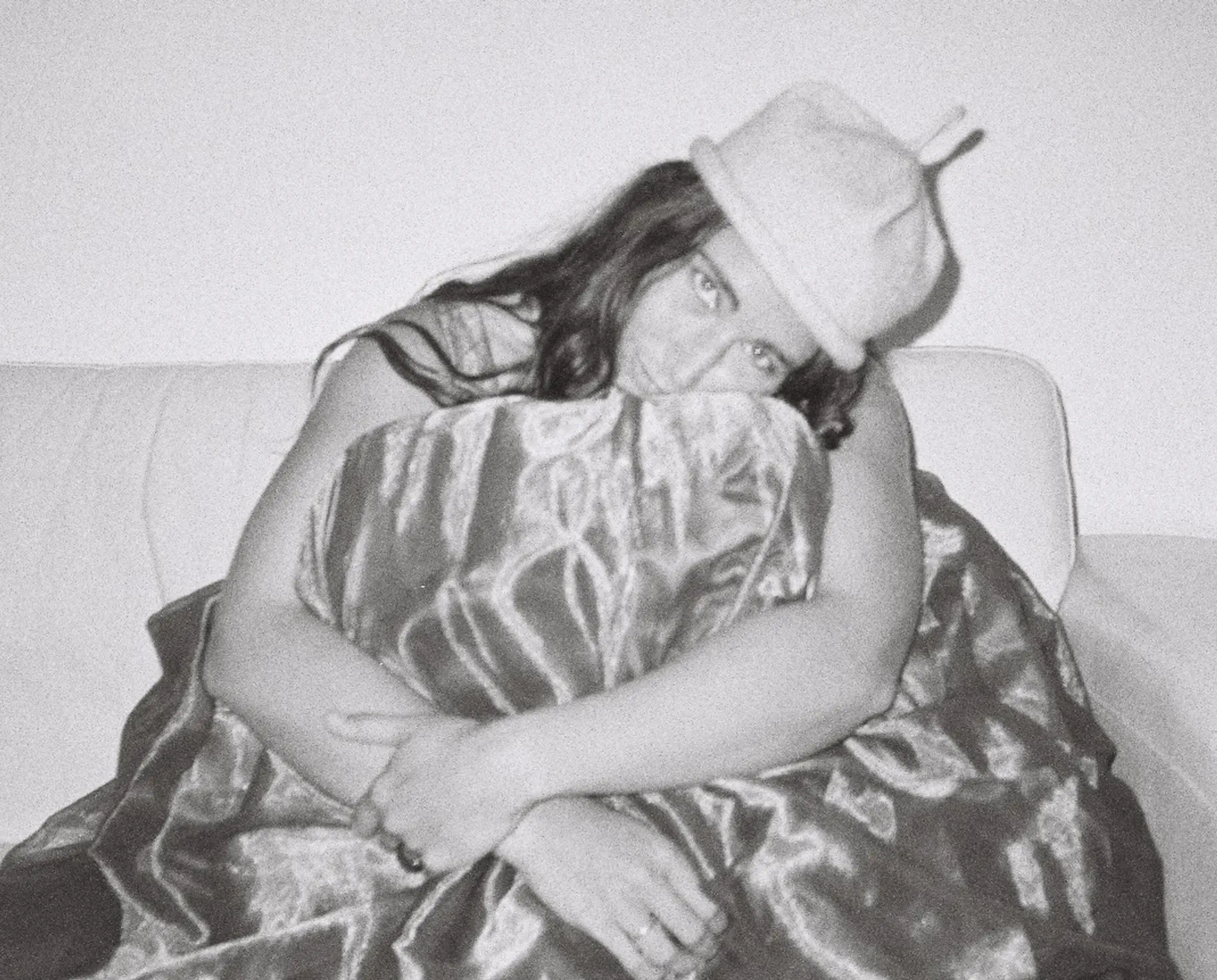Woman wearing a Bonnie Wore hand knitted possum merino Loop Hat, handmade in New Zealand, black and white portrait.