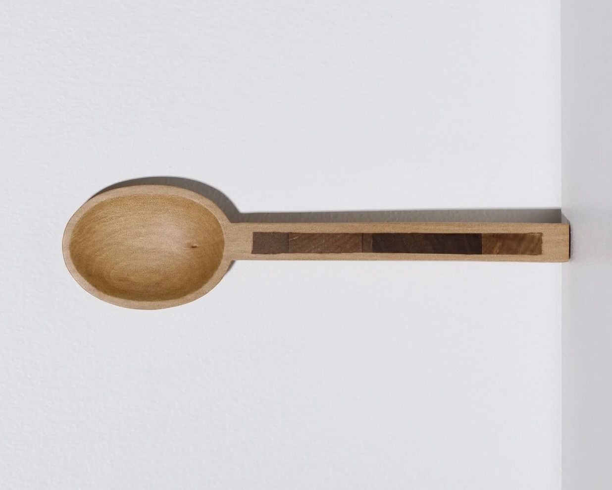A hand carved inset spoon from Courtney Petleys 100 piece series hand made in Aotearoa, New Zealand