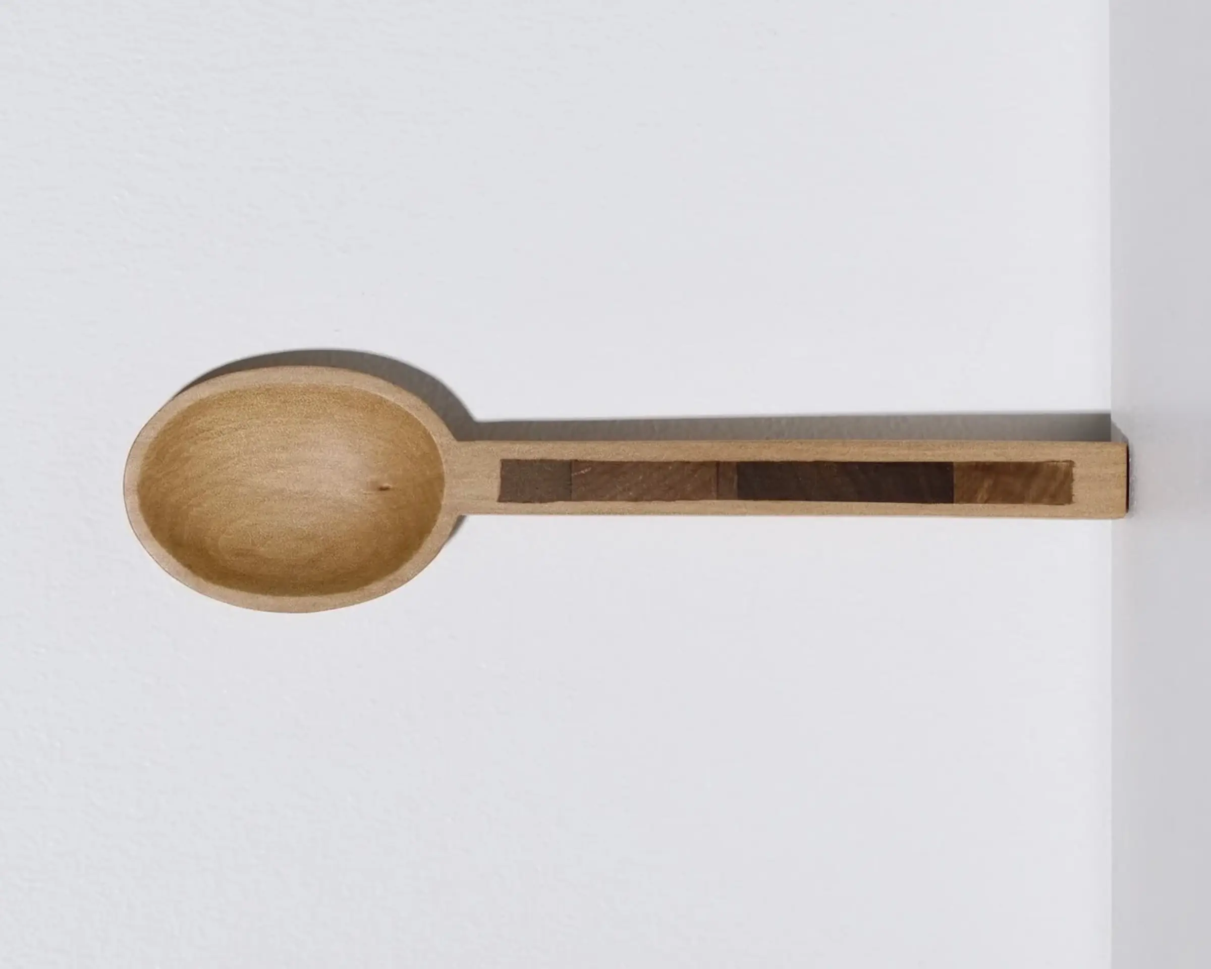 A hand carved inset spoon from Courtney Petleys 100 piece series hand made in Aotearoa, New Zealand