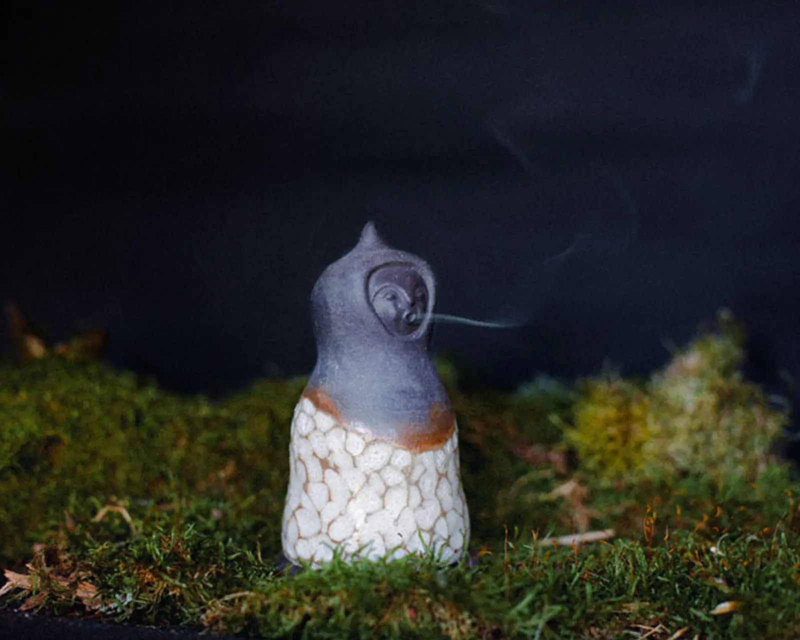Ceres No.1 ceramic incense burner on a mossy bed with a dark background