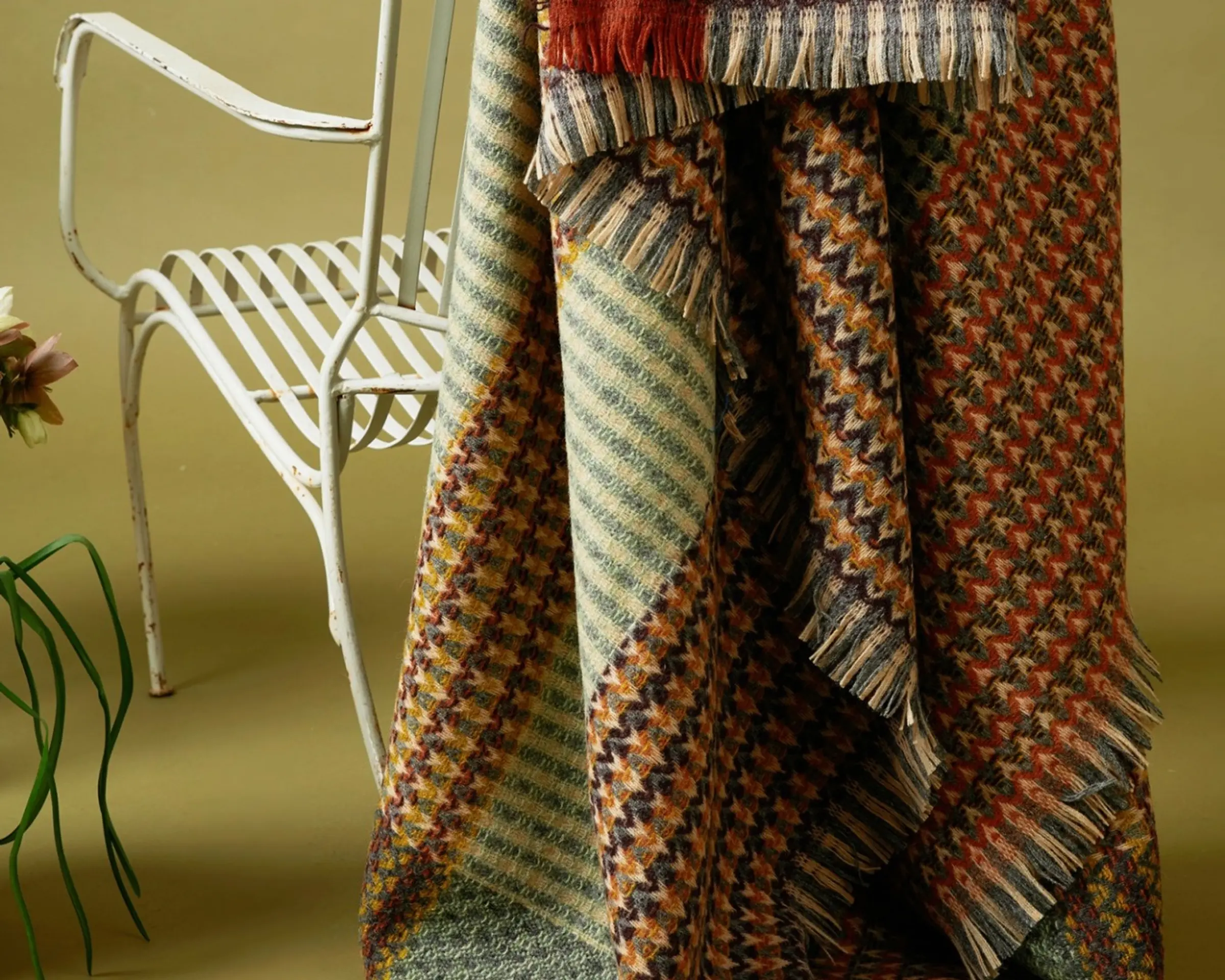 a blanket draped on the back of a chair