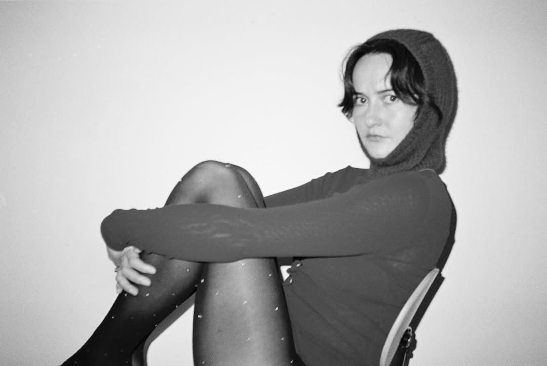 Woman wearing a Bonnie Wore Balaclava, hand knitted in New Zealand from premium possum merino.