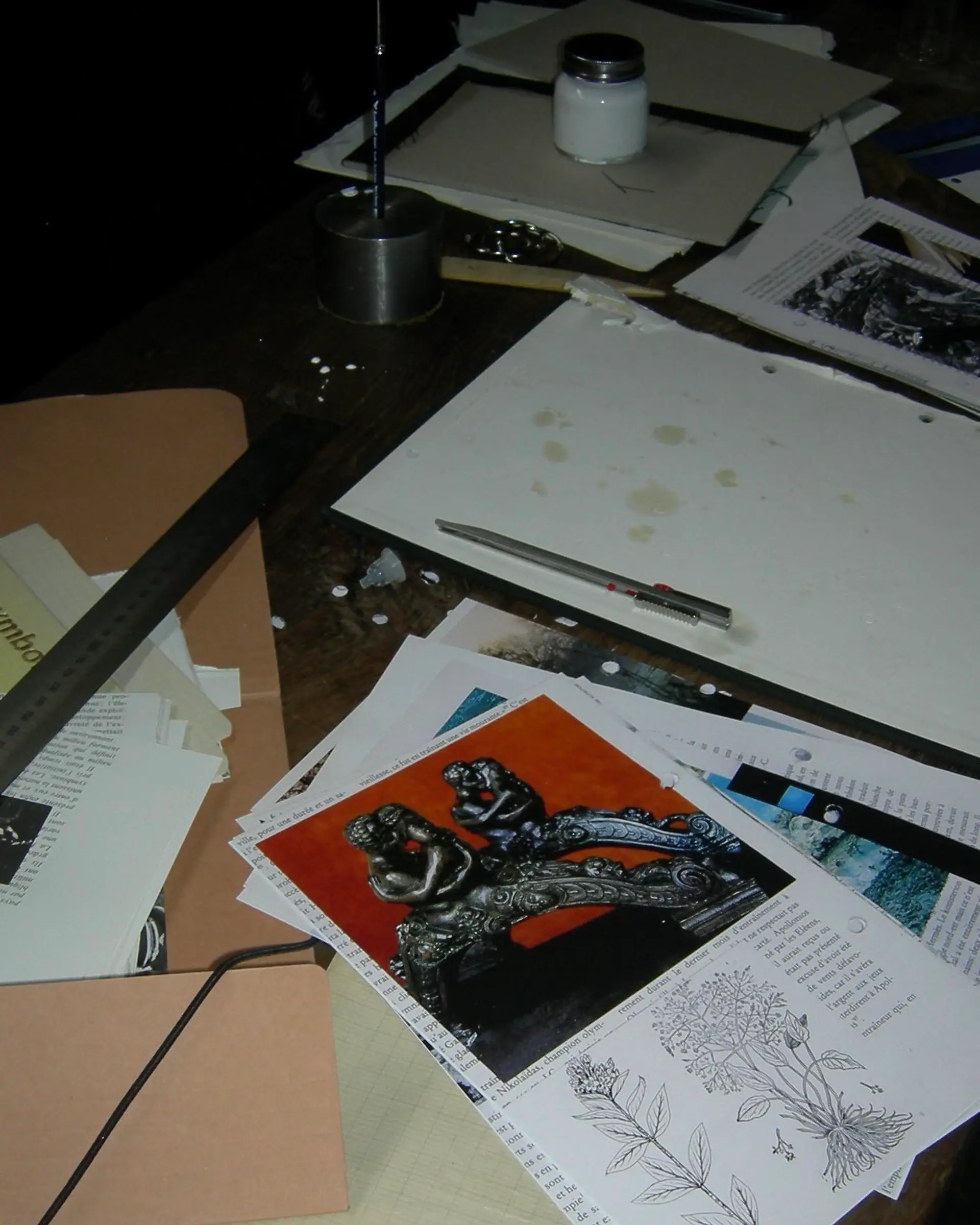 A desk of a perfumer with research papers