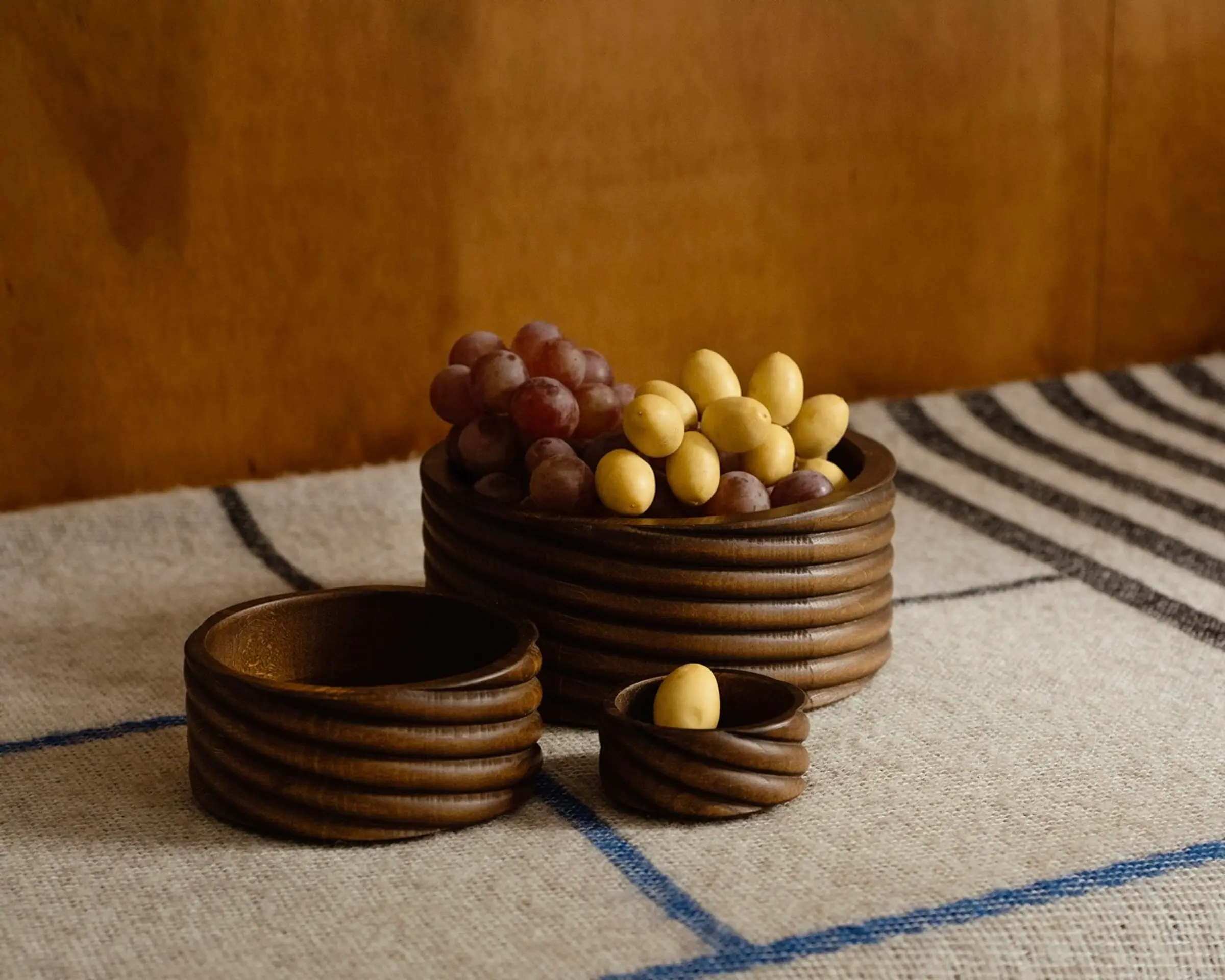 oros torsade collection of small medium and large bowls on a wool blanket
