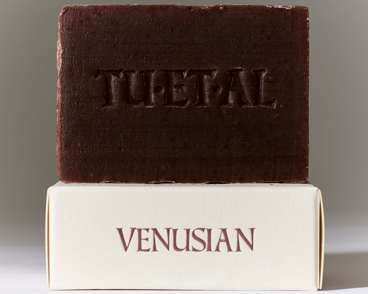 Tuétal Venusian cold process bar soap handcrafted with madder root, botanical oils and floral essential oils in a deep burgundy bar.