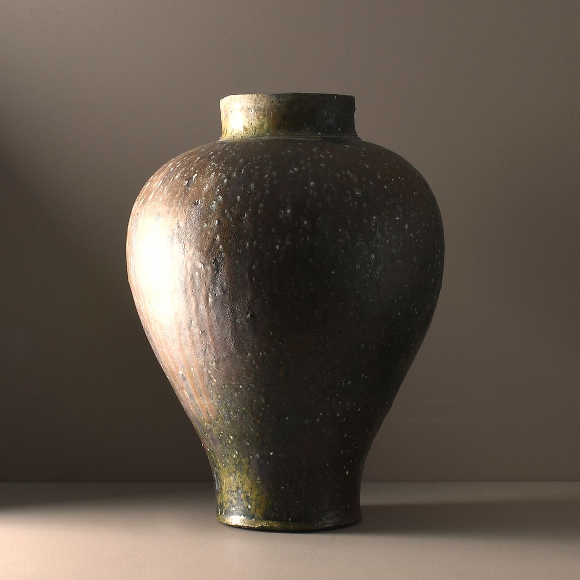Large anagama-fired stoneware vase by Holly Rose Morgan from the Burning Ground Collection, crafted from hand-dug Coromandel clay with rich iron tones and a raw unglazed surface shaped by wood firing, available at Handcrafted Modern.
