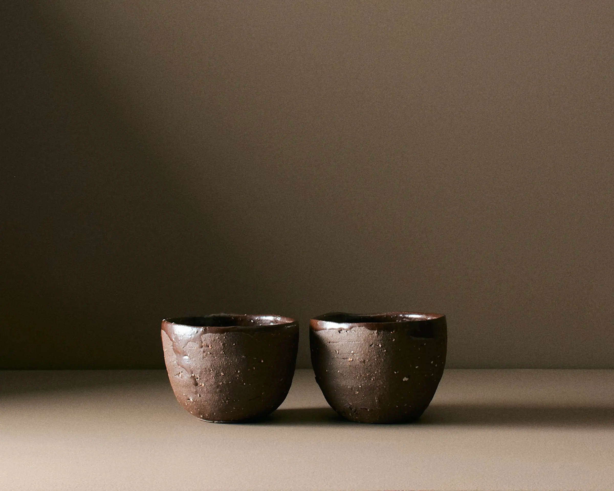 brown handmade pottery cups