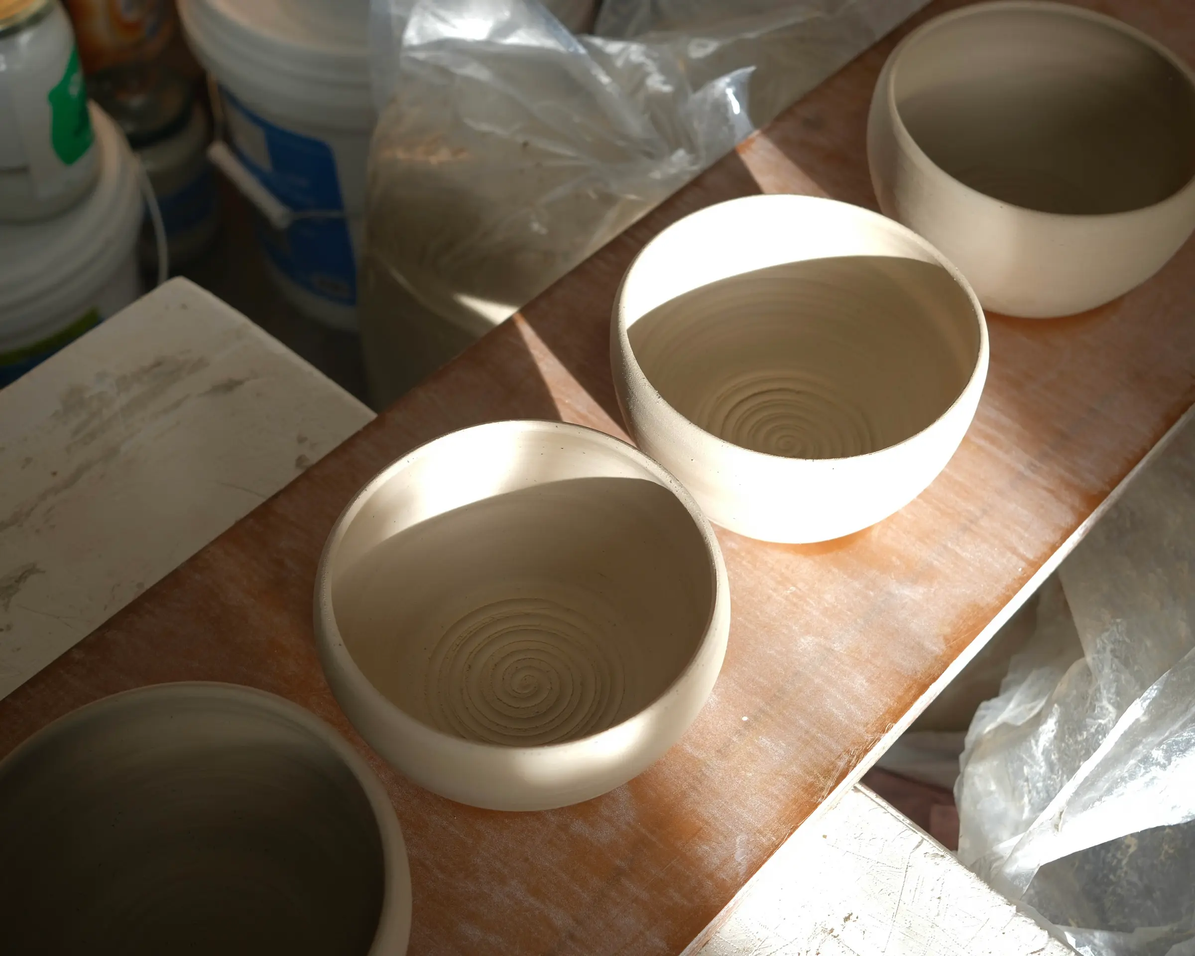 A hand-altered stoneware tea bowl by Tāmaki Makaurau ceramic artist Kaiqi Qiu, wheel-thrown and electric fired from her Grey Lynn studio.