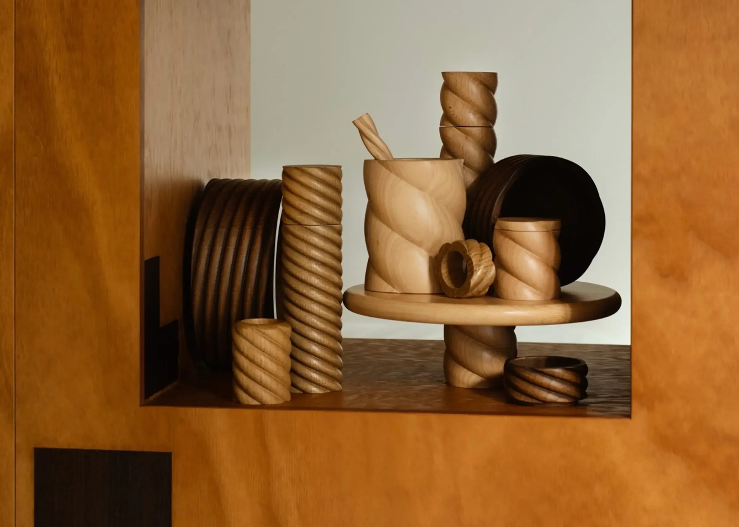 A collection of hand turned wooden pieces from Oros Design, all from the torsade collection featuring twists based off 17th century turned wood legs.