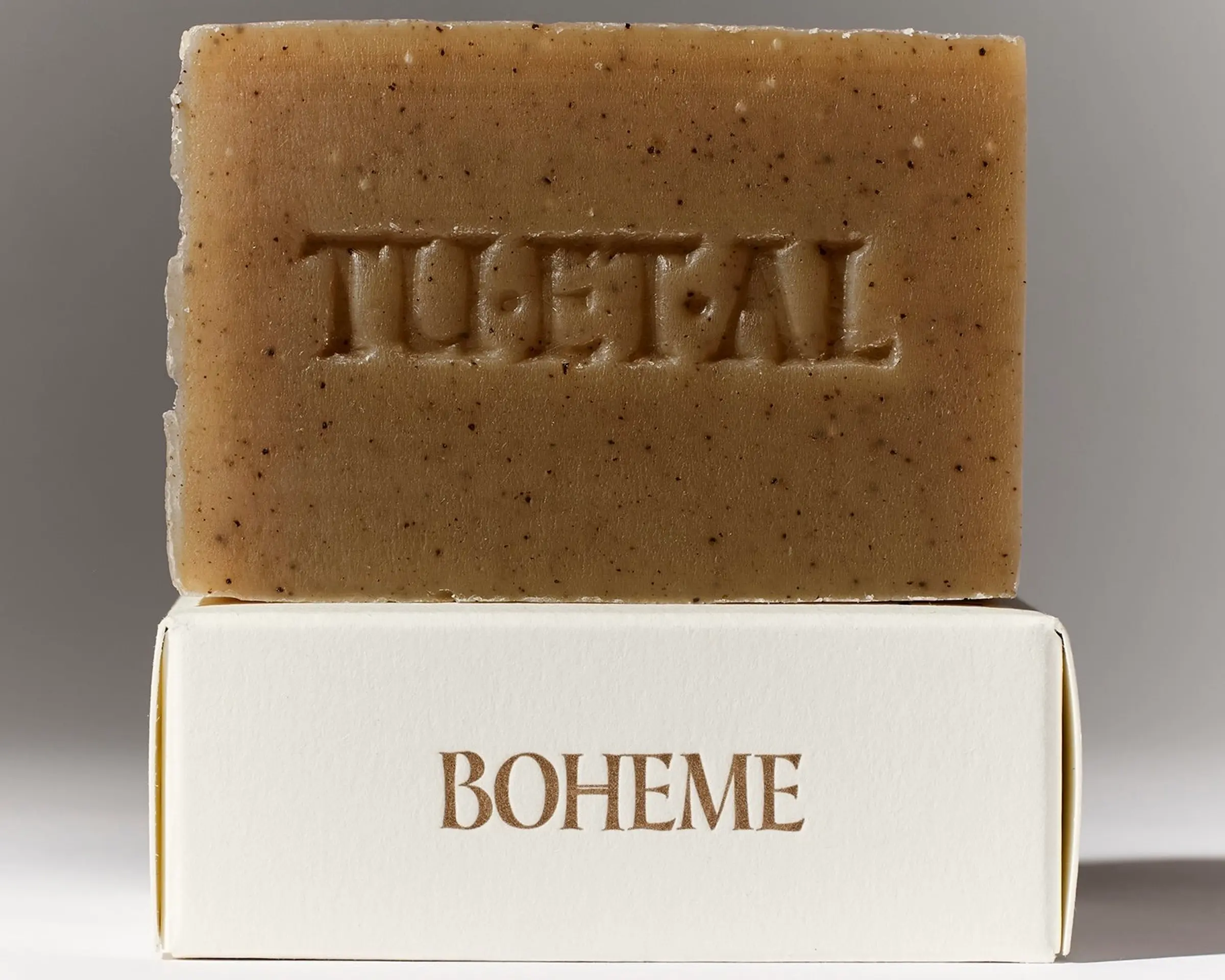 Tuétal Boheme cold process bar soap handcrafted with coffee, botanical oils and woody essential oils in a warm caramel-coloured bar.