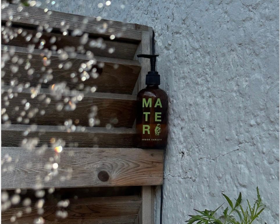 Mater soap on a wooded fence in an outdoor shower setting