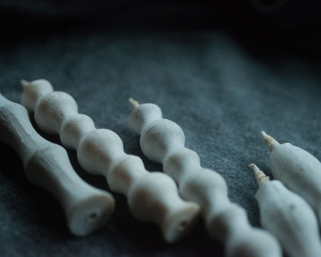 Takazawa candles on a deep grey fabric