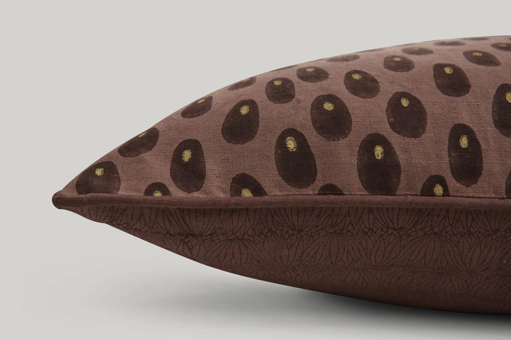 a close up of the print for Studio fords Sphinx lumbar cushions in brown tones