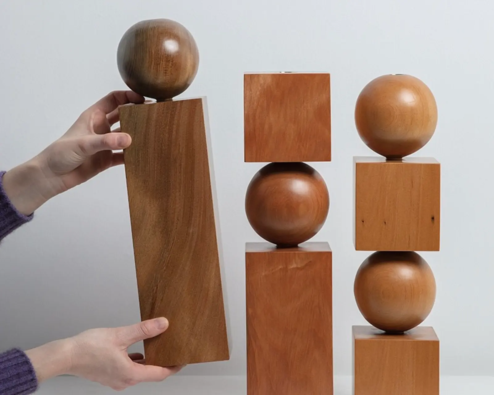 a trio of New Zealand woodworker Courtney pelters Moon series candle holders, hand made from native timbers