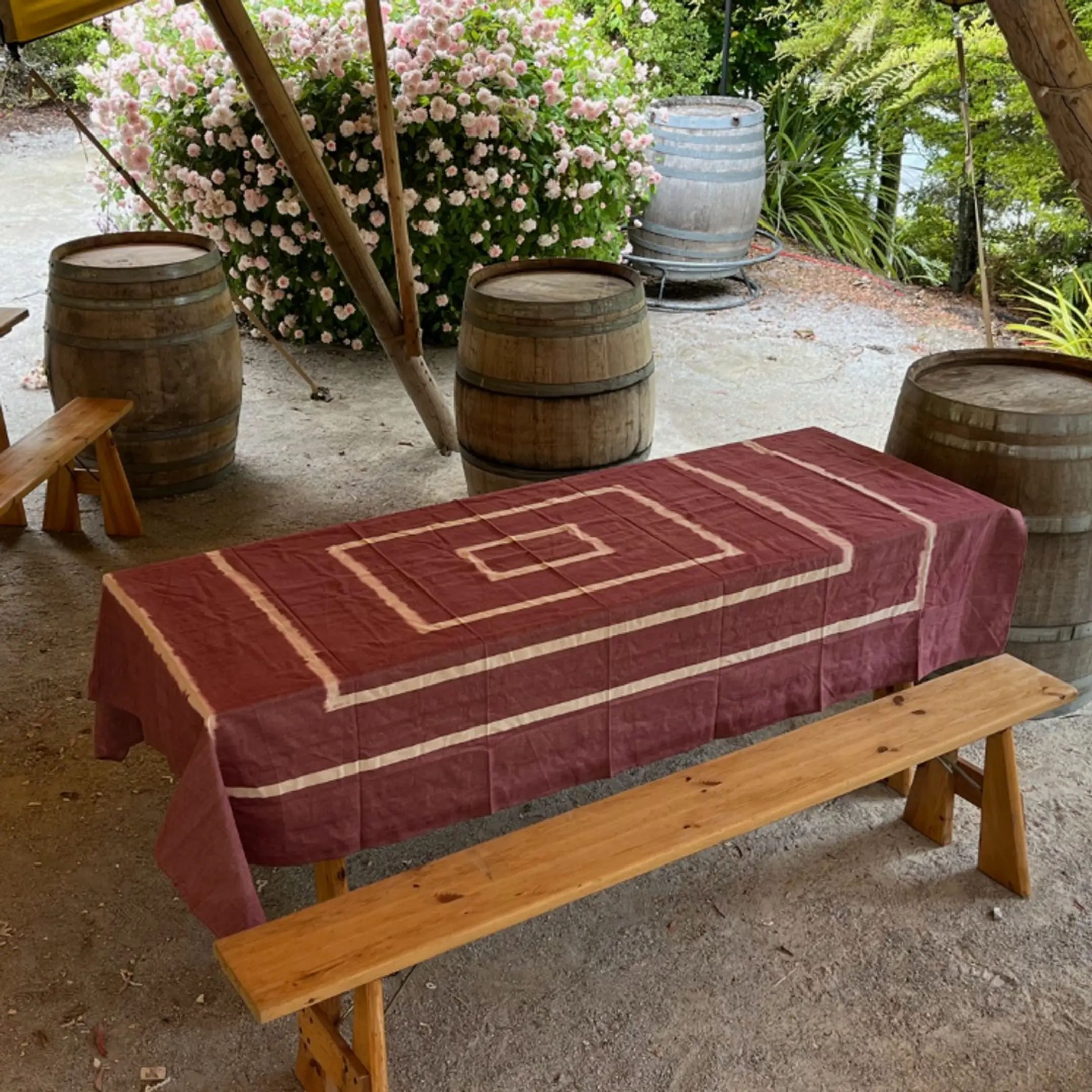 an ikat tablecloth on a wooden outdoor table