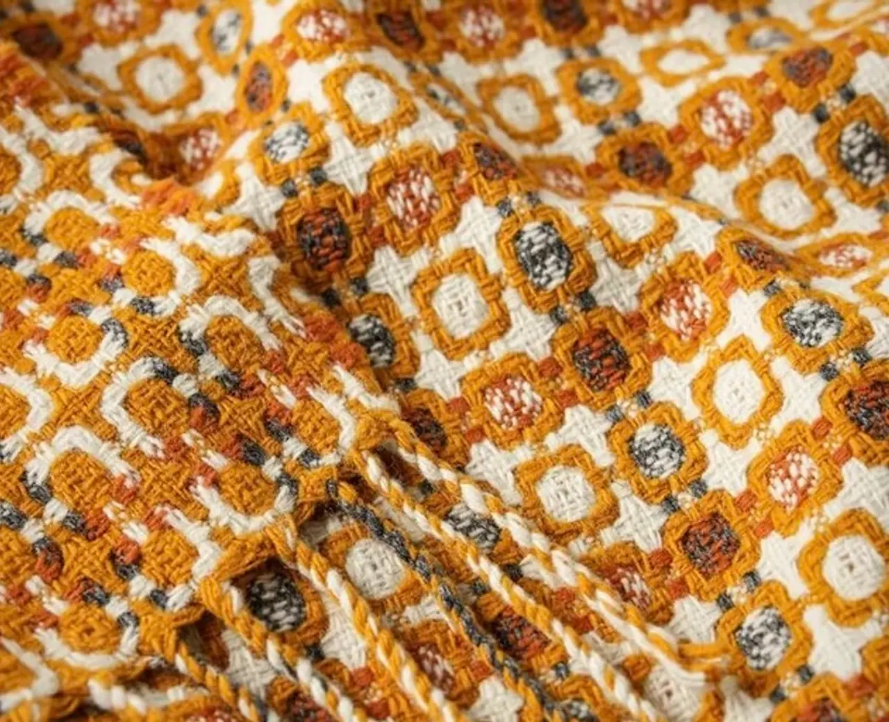 A close up of the 1974 vintage weave of the bural blanket