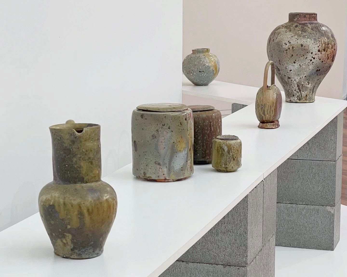 An anagram vase from Holly rose Morgan on a white plinth and background