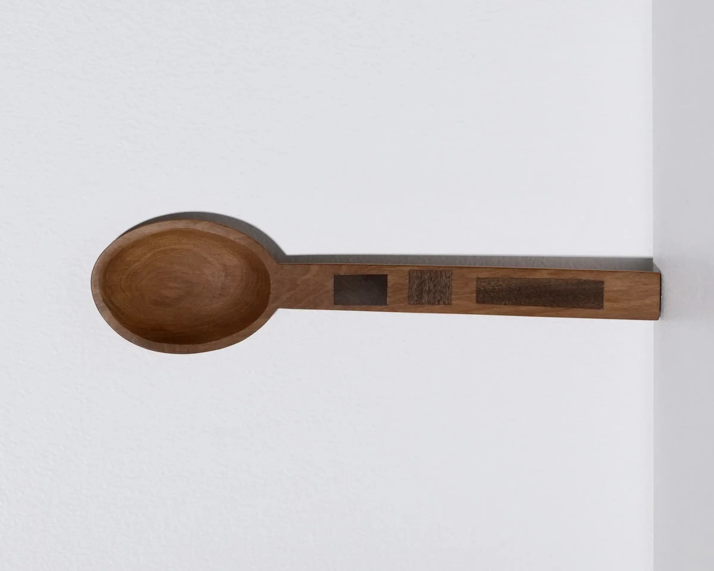 A hand carved inset spoon from Courtney Petleys 100 piece series hand made in Aotearoa, New Zealand