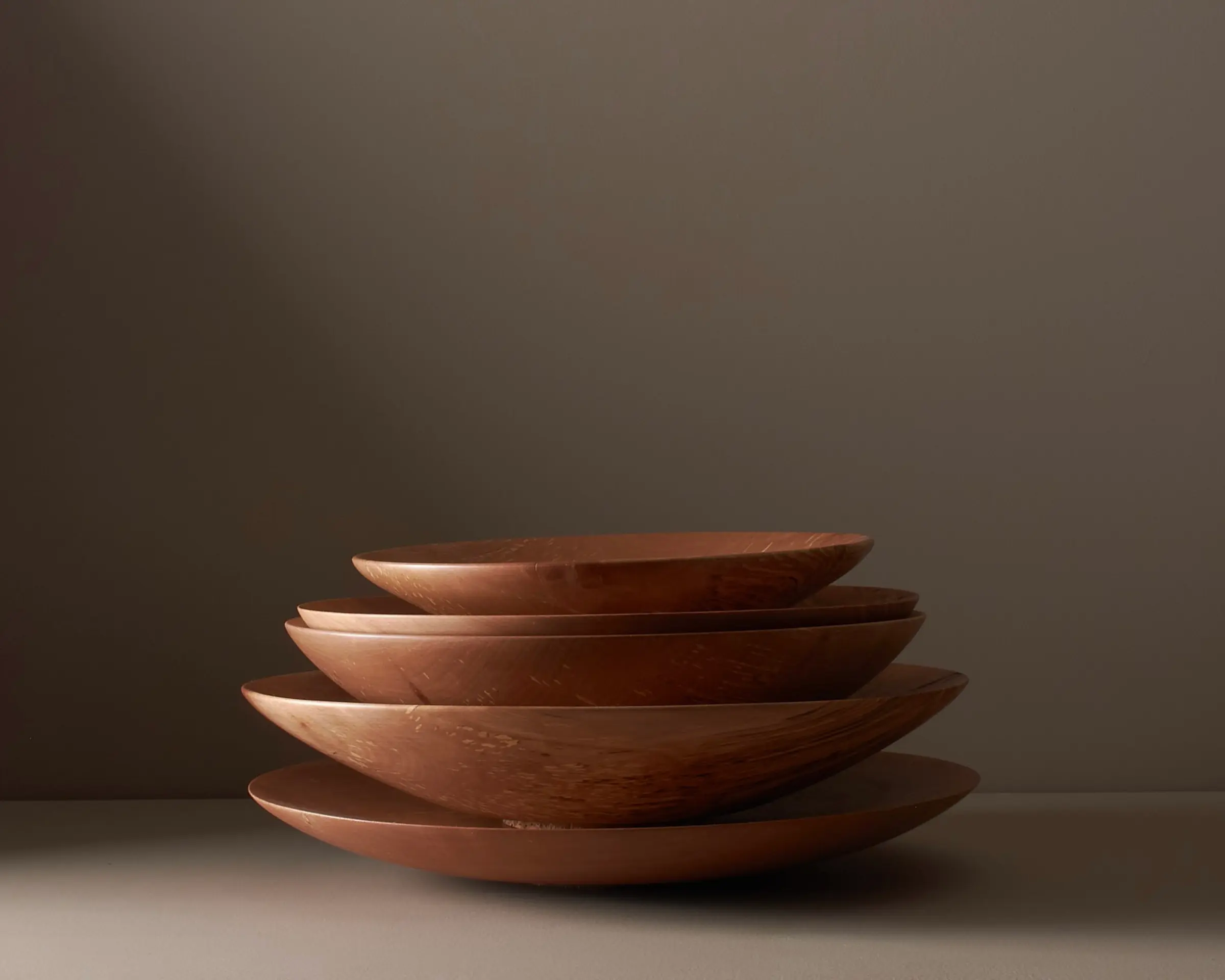 a stack of hand turned wooden bowls