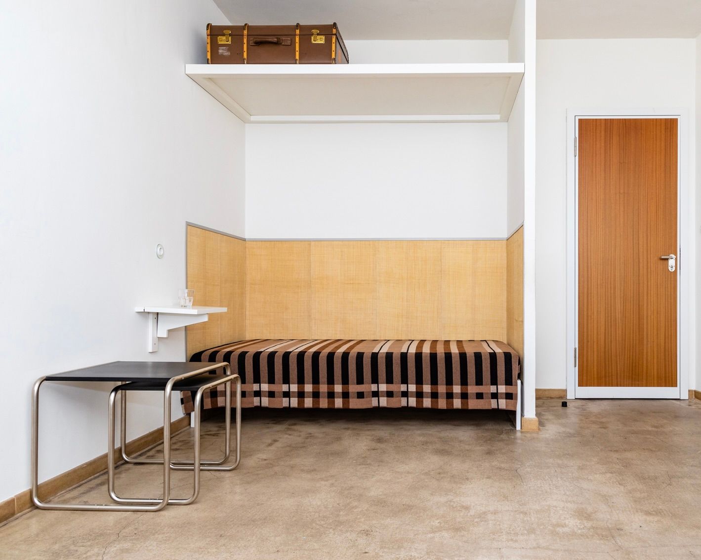 A Wallace Sewell Blanket in a Bauhaus dorm room setting.
