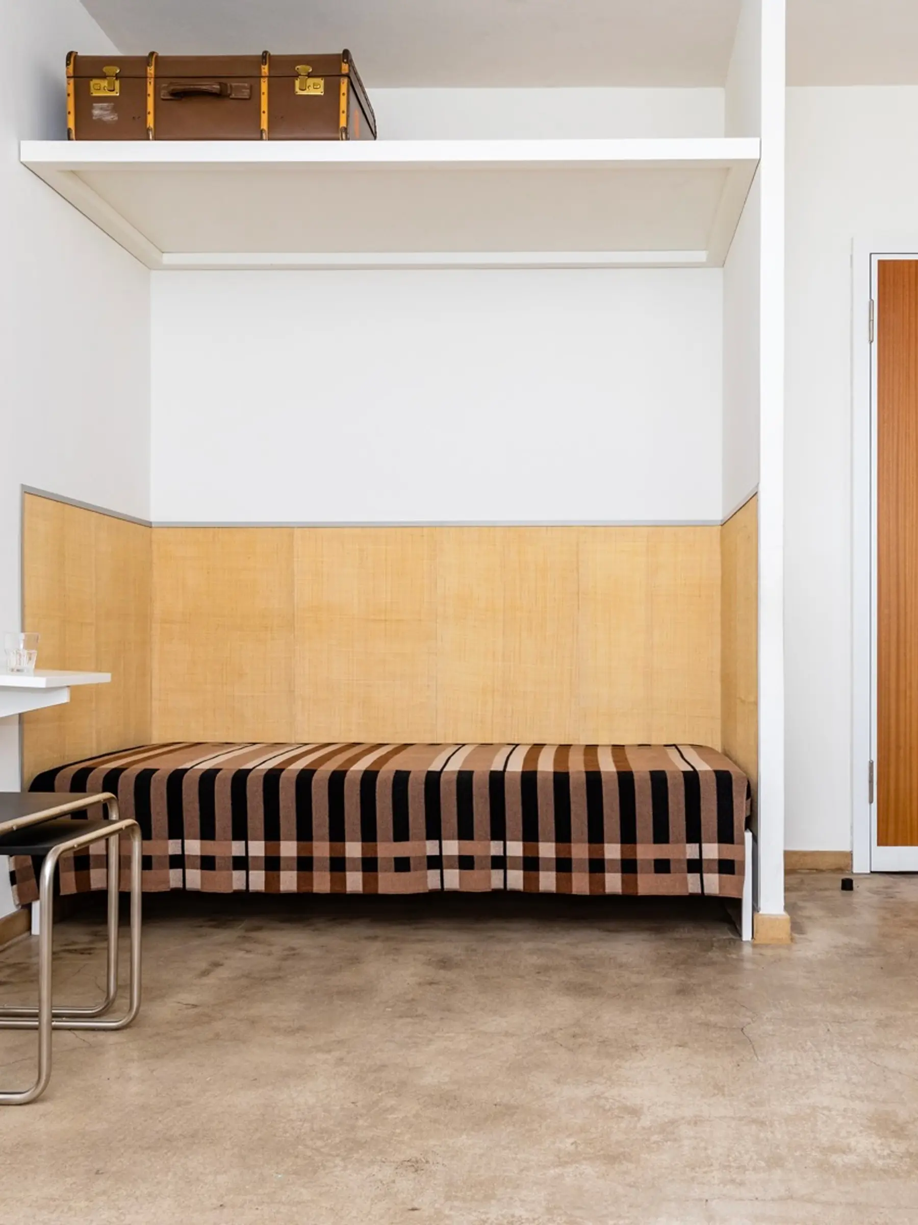A Wallace Sewell Blanket in a Bauhaus dorm room setting.