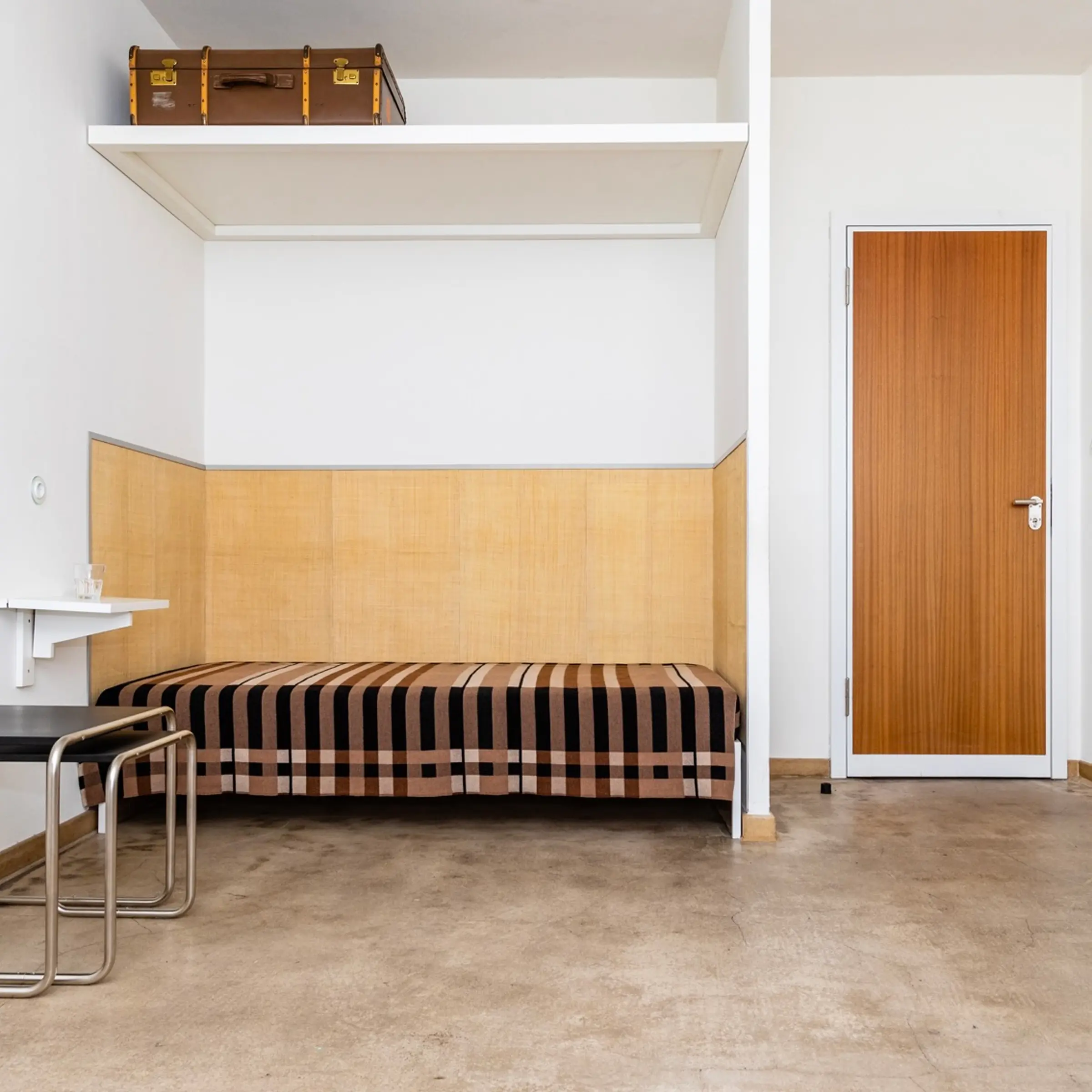 A Wallace Sewell Blanket in a Bauhaus dorm room setting.