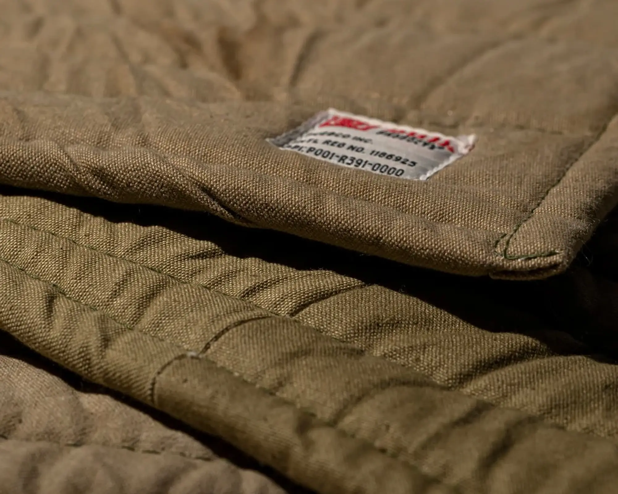 a close up of the cotton canvas vintage bivouac trivet from Puebco