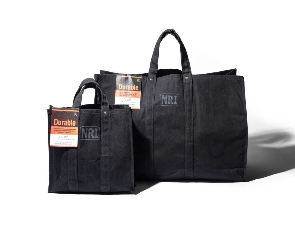 the Puebco labour tote bags in small and large next to each other