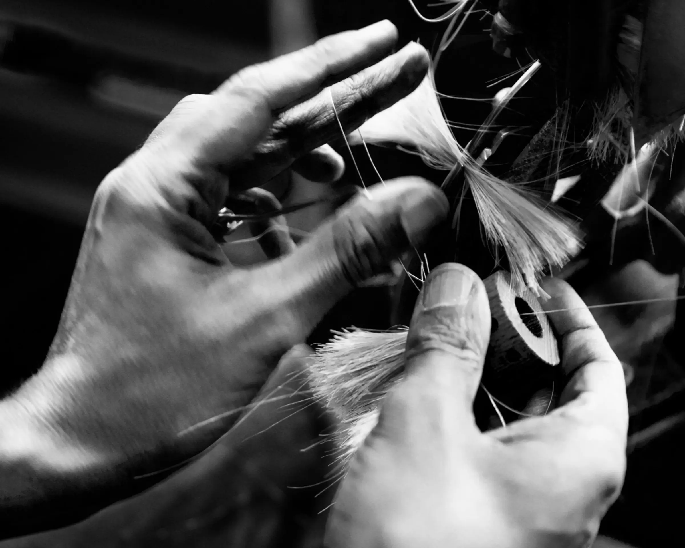 an image of a worker making brushes