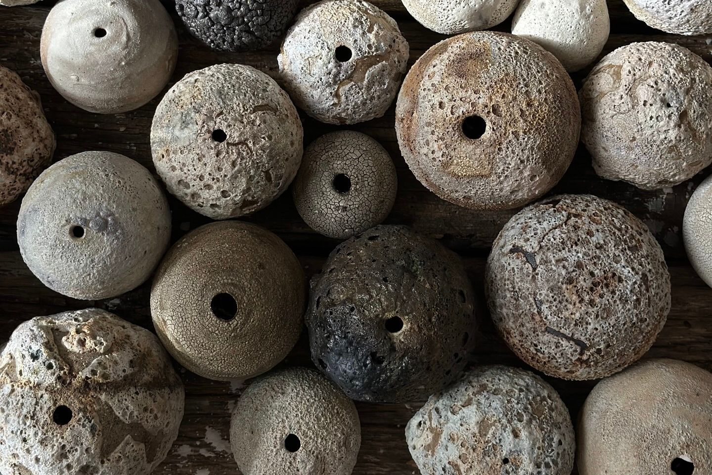 A collection of bud vases from Maria Loram in different glazes and organic forms