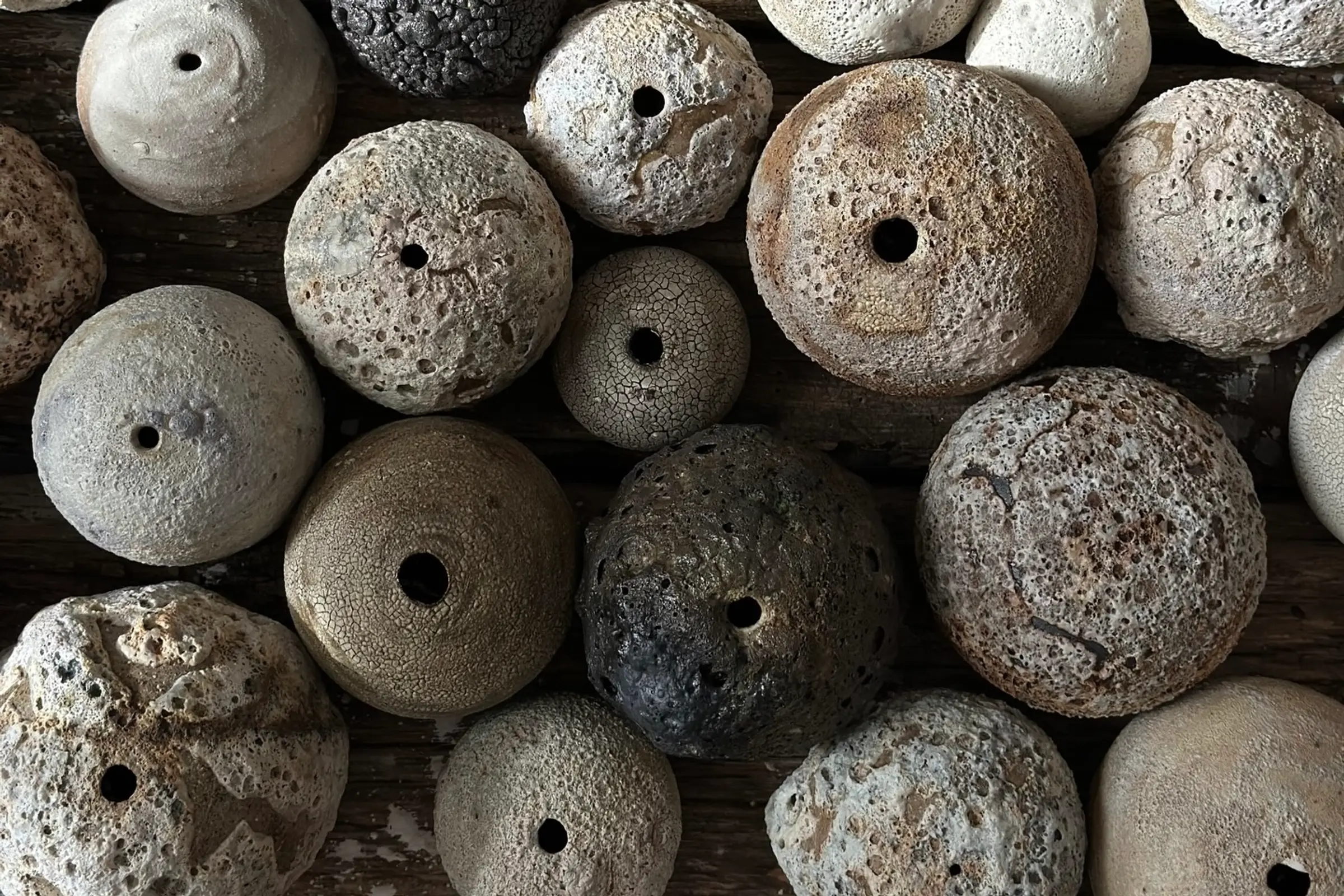 A collection of bud vases from Maria Loram in different glazes and organic forms