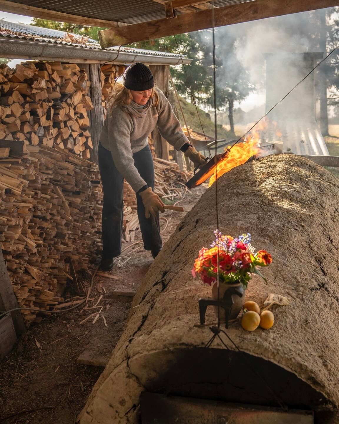 Holly rose Morgan at a wood kiln firing her ceramic pieces 
