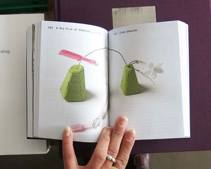 open pages inside The Material Kinship book on a table