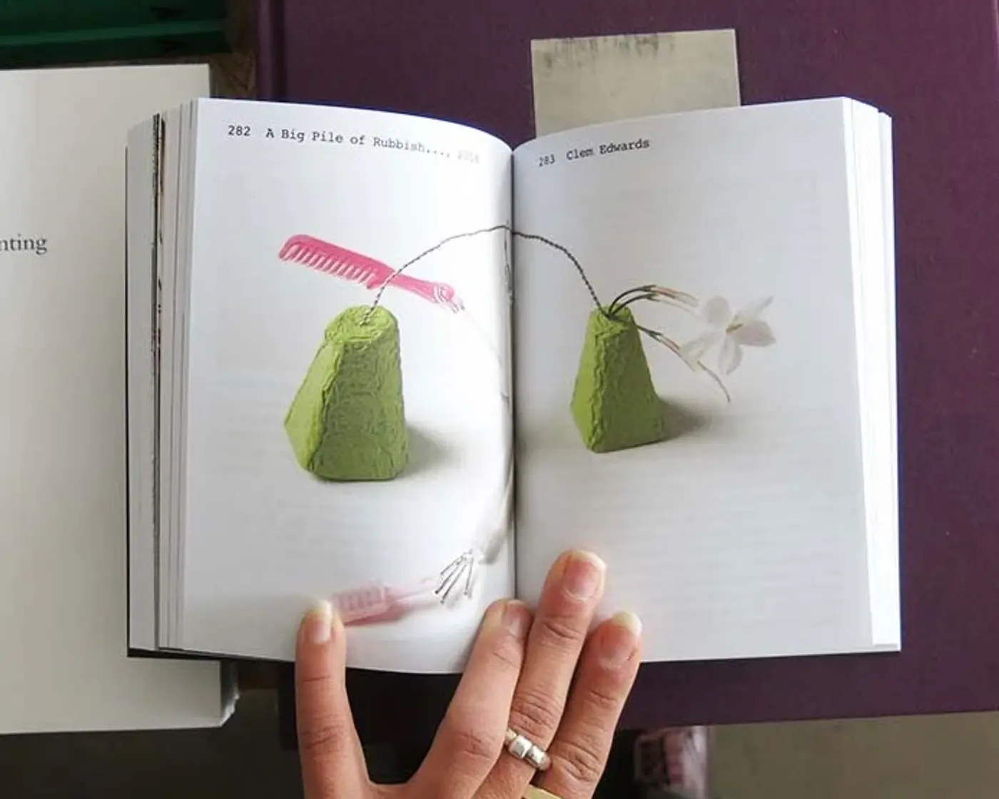 open pages inside The Material Kinship book on a table