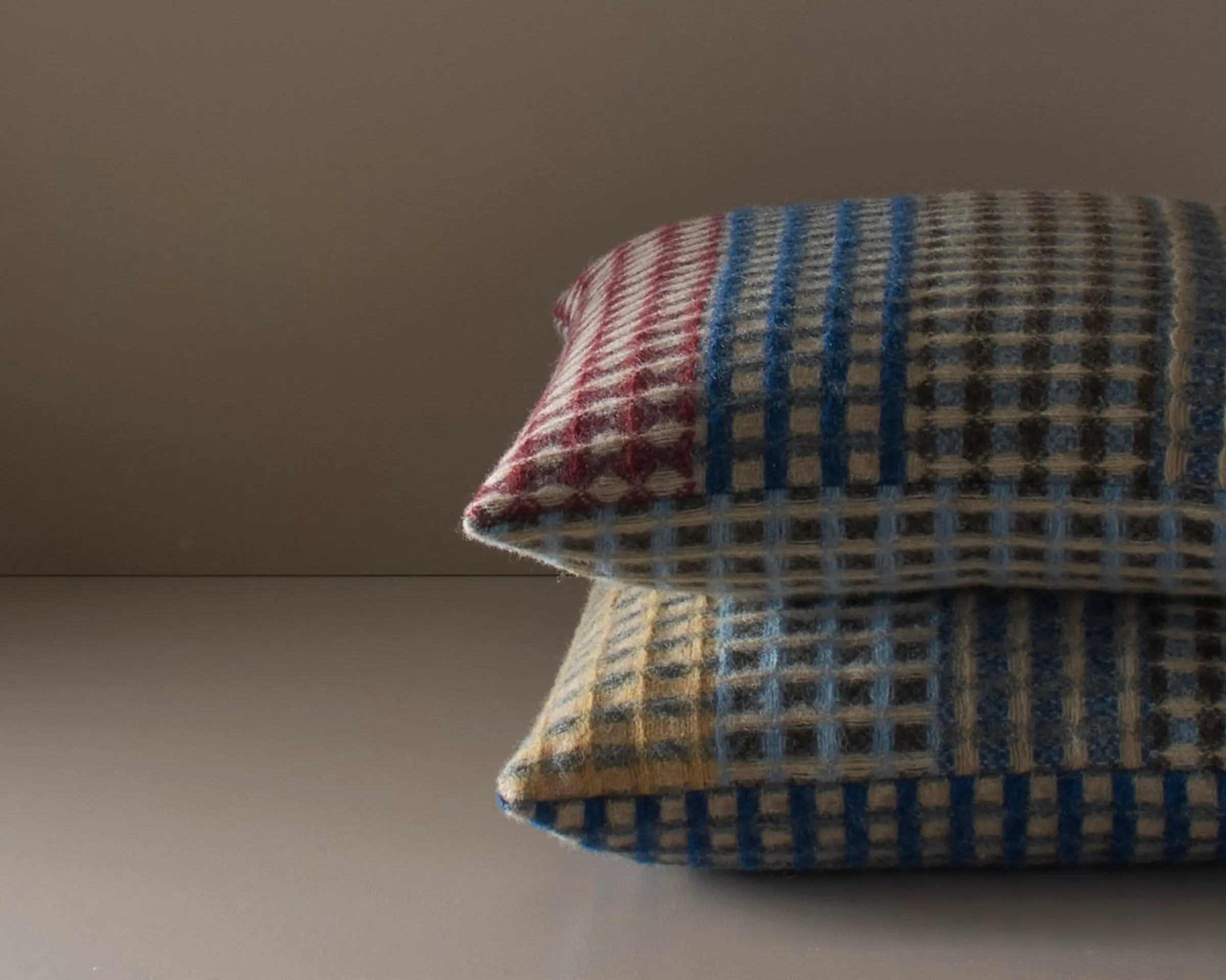 a detail photo of a pair of shetland wool cushions