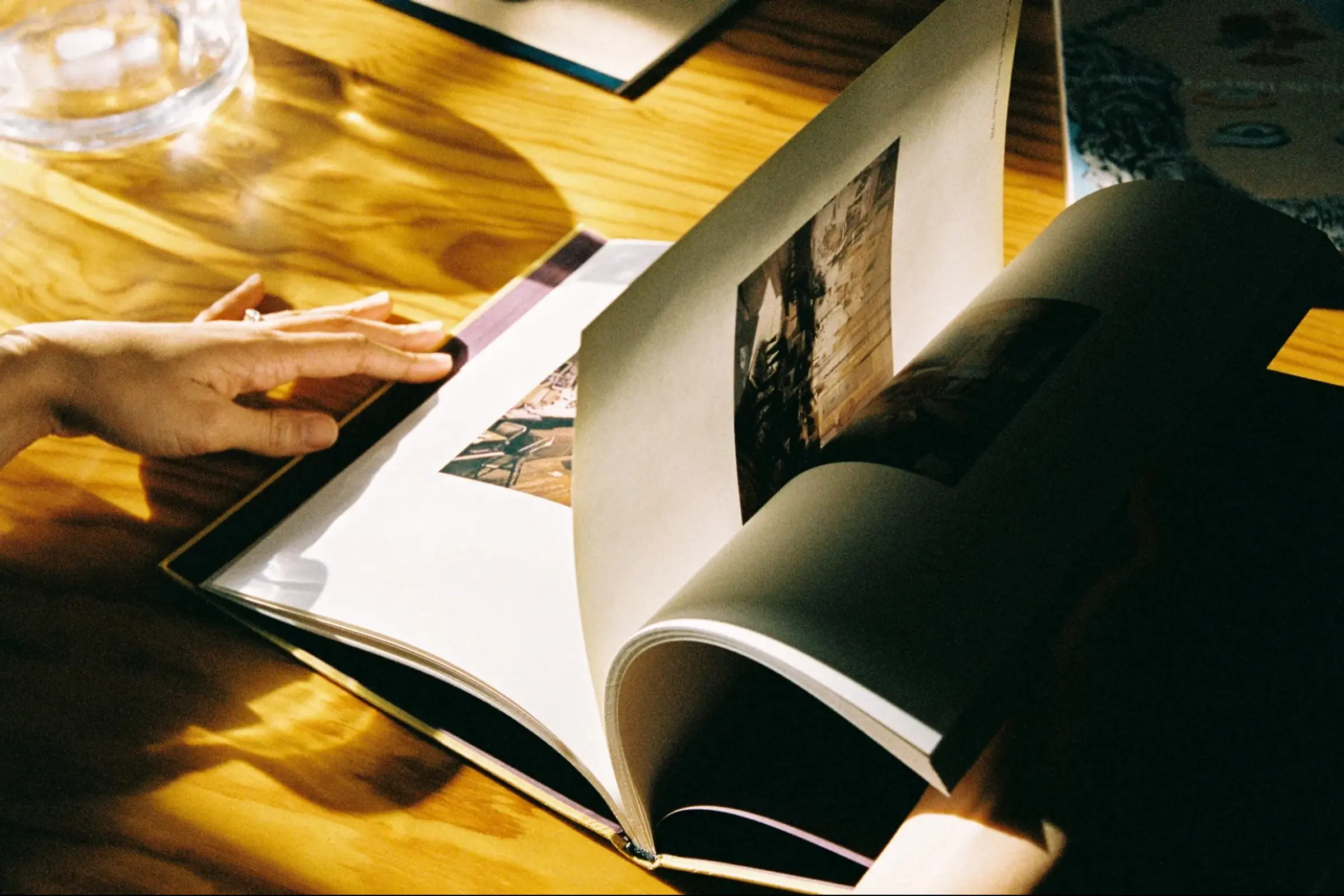 a book on a table being flicked through