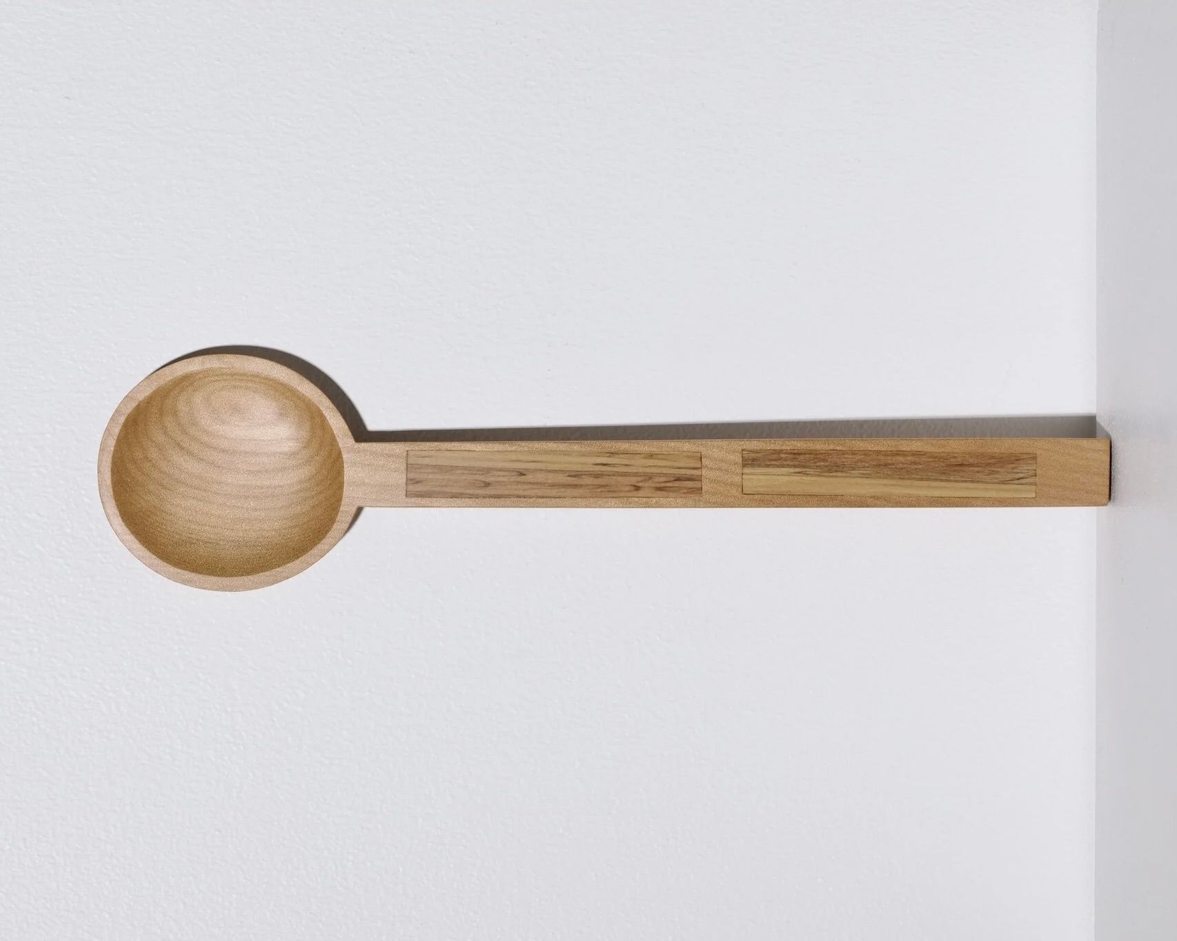 A hand carved inset spoon from Courtney Petleys 100 piece series hand made in Aotearoa, New Zealand