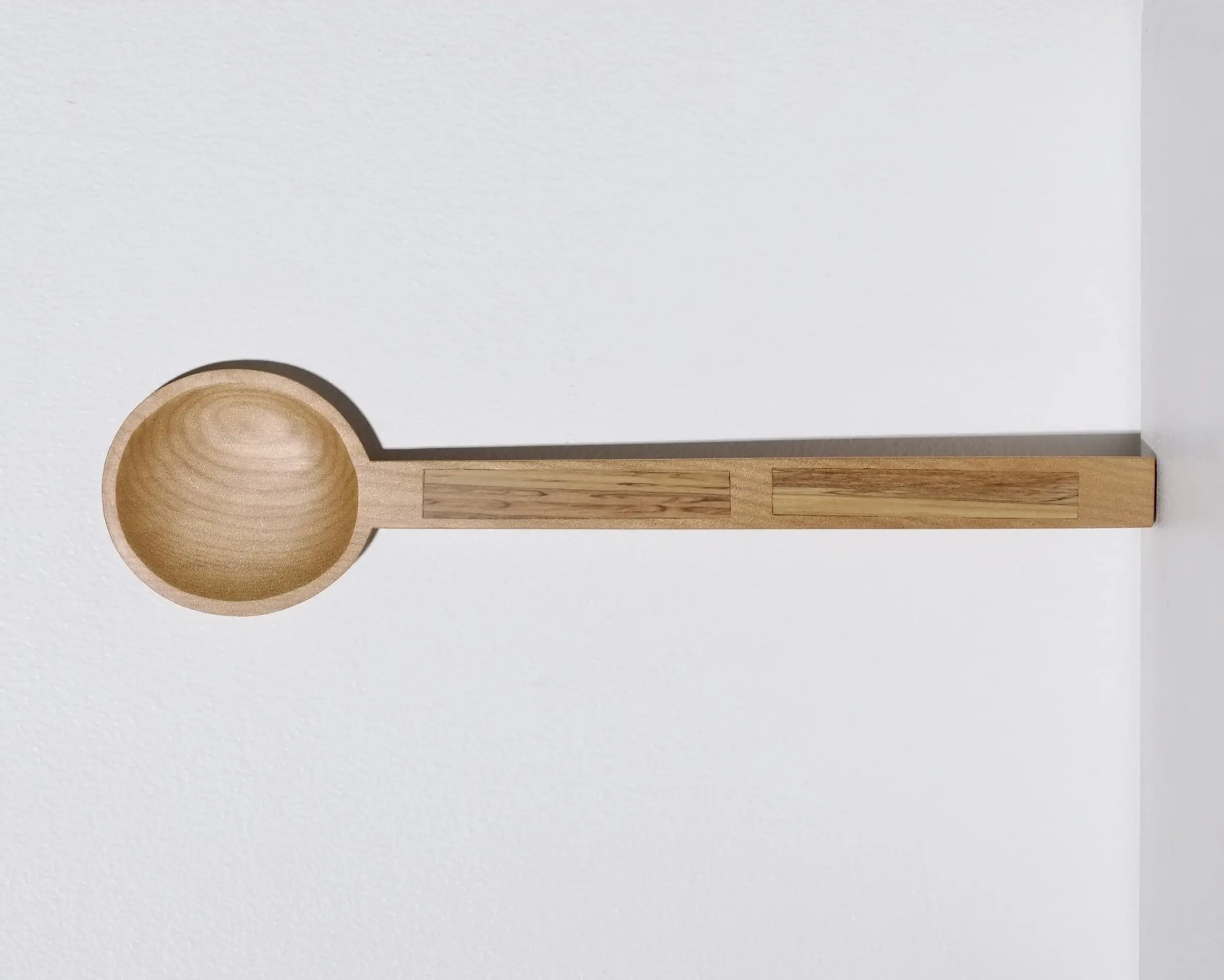 A hand carved inset spoon from Courtney Petleys 100 piece series hand made in Aotearoa, New Zealand