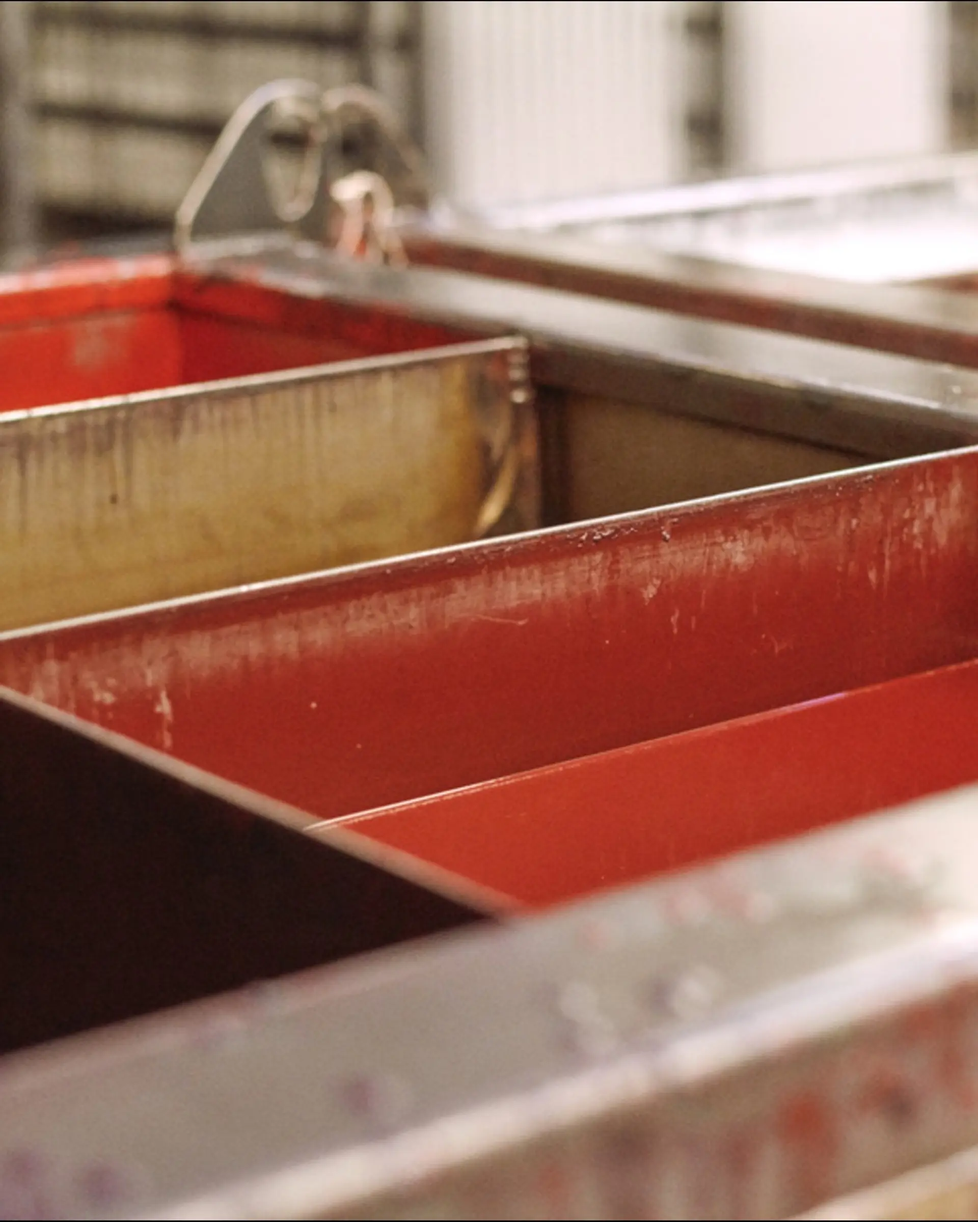 tubs full of hot wax for candle making