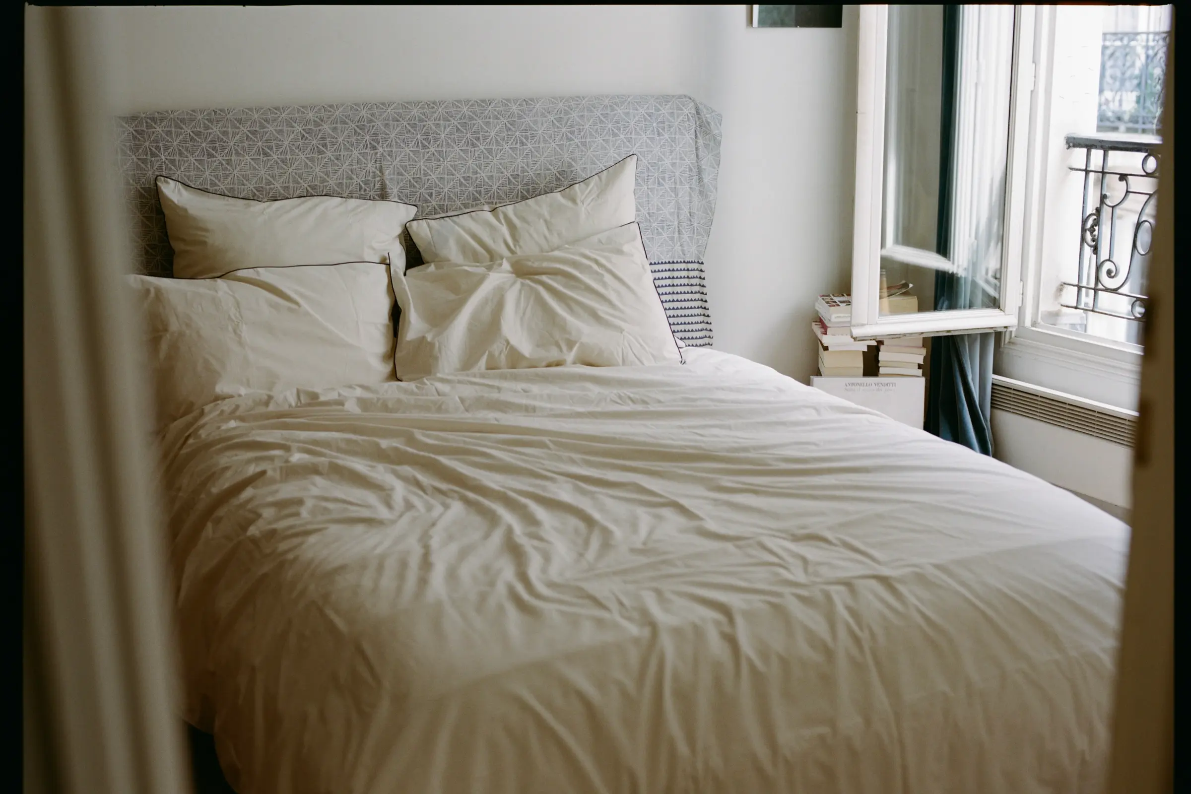 SUTRAM Canvas organic cotton percale bedding featuring a duvet cover, piped standard pillowcases and Euro pillowcases, styled in a light-filled heritage bedroom.