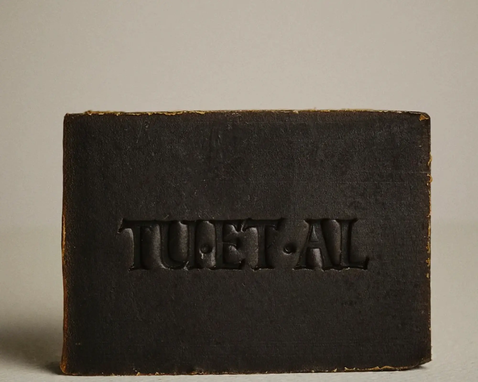 a bar of deep umber coloured soap