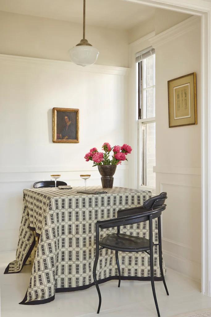Studio Ford Vesuvius Table cloth on a table setting in an art deco building with Italian designer chairs 