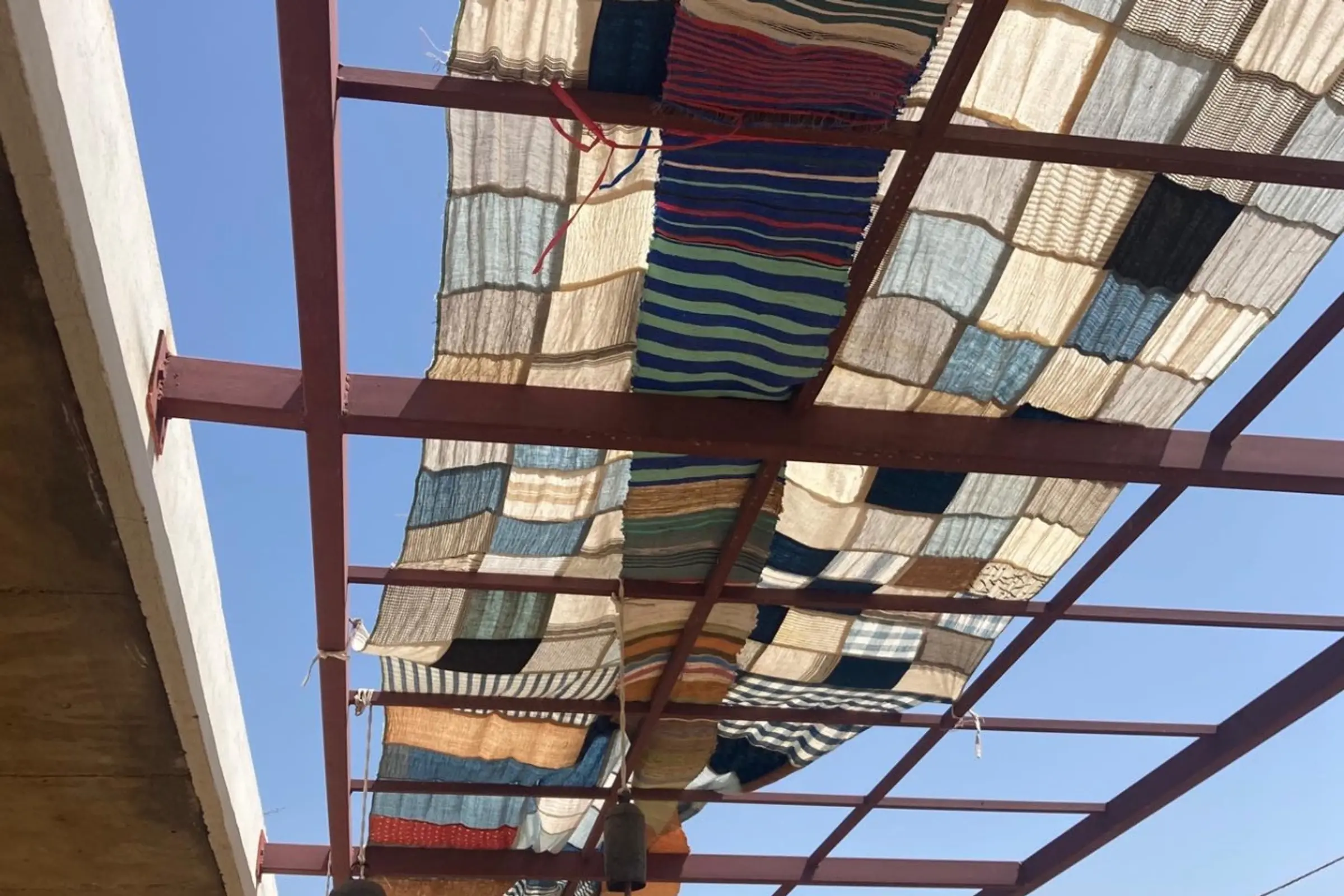 textiles sewn together in a patchwork to create a shade cover