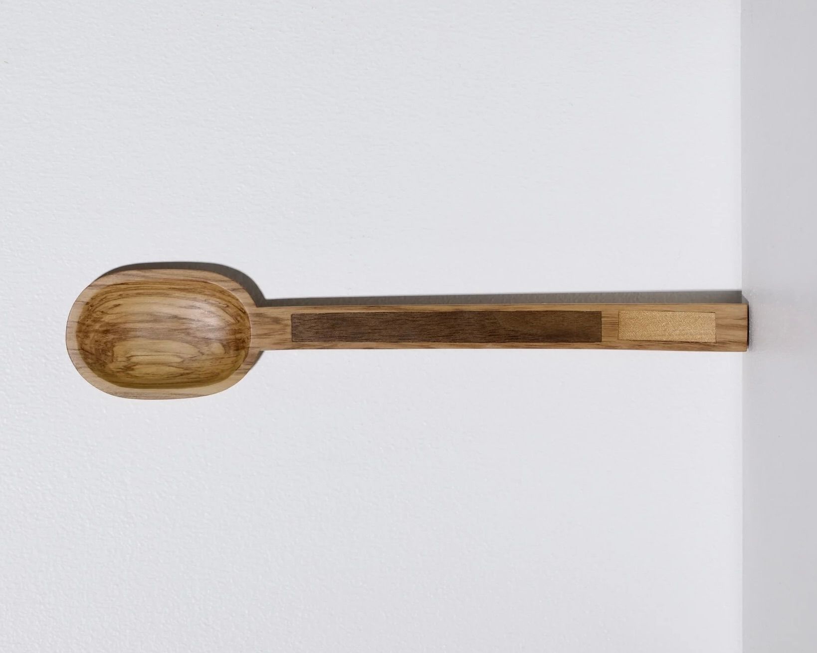 A hand carved inset spoon from Courtney Petleys 100 piece series hand made in Aotearoa, New Zealand