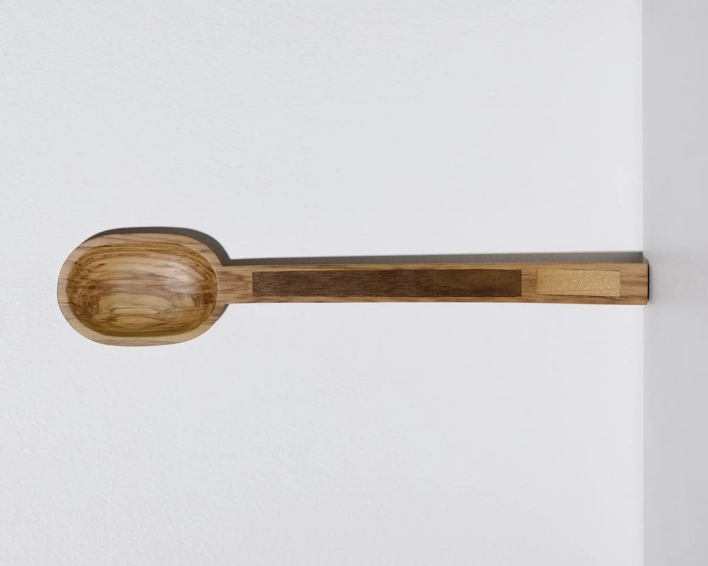 A hand carved inset spoon from Courtney Petleys 100 piece series hand made in Aotearoa, New Zealand