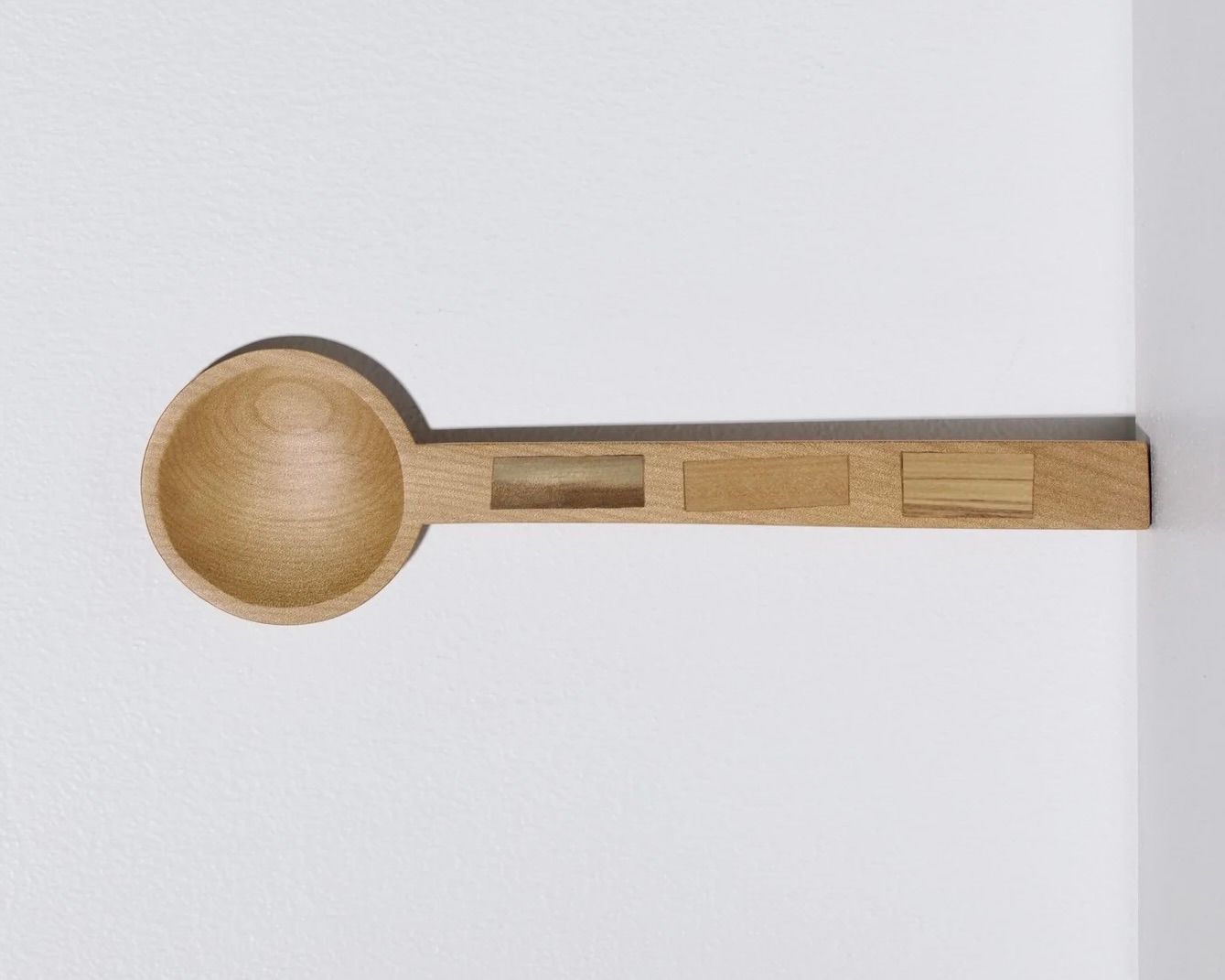 A hand carved inset spoon from Courtney Petleys 100 piece series hand made in Aotearoa, New Zealand