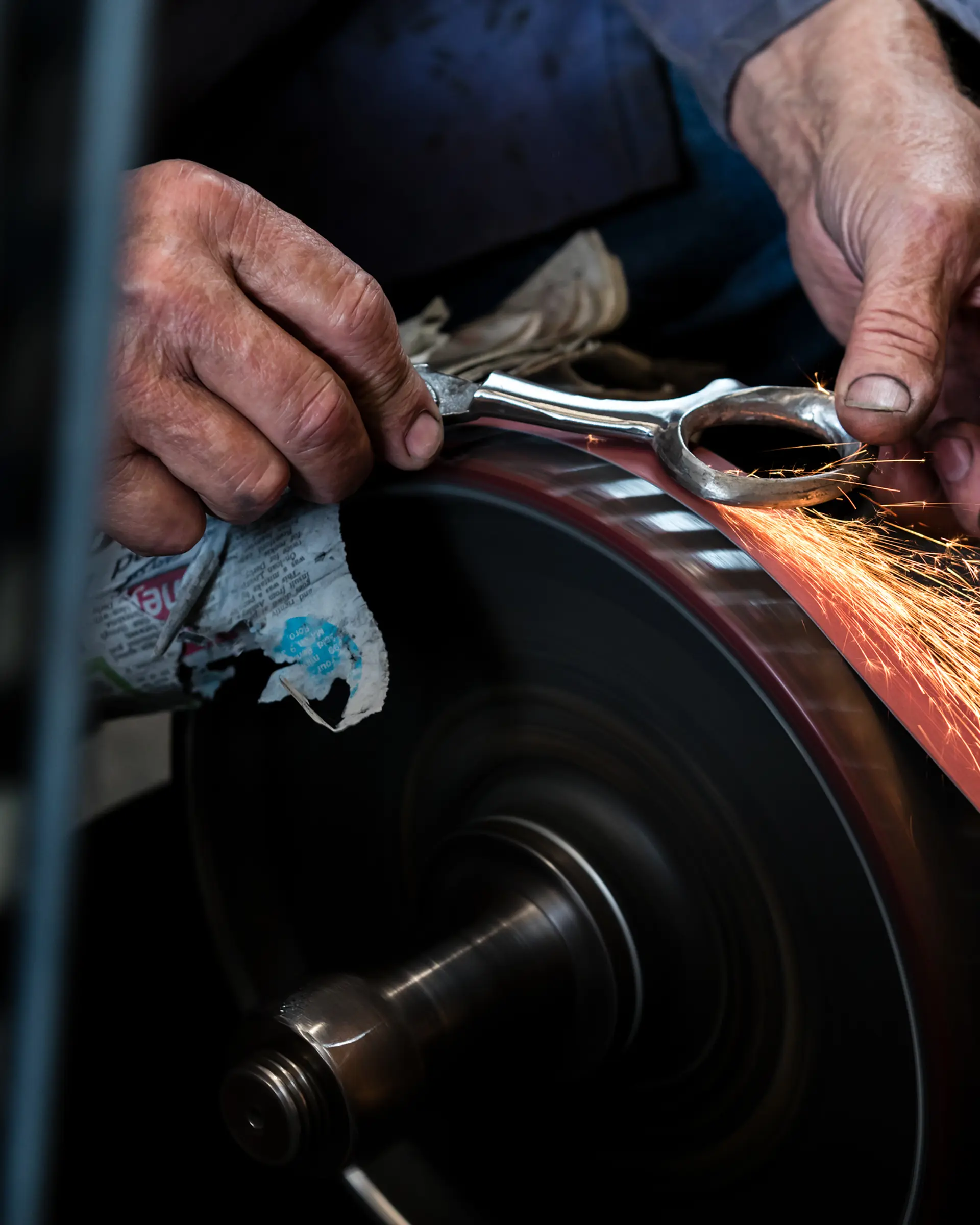 metal scissors being sanded
