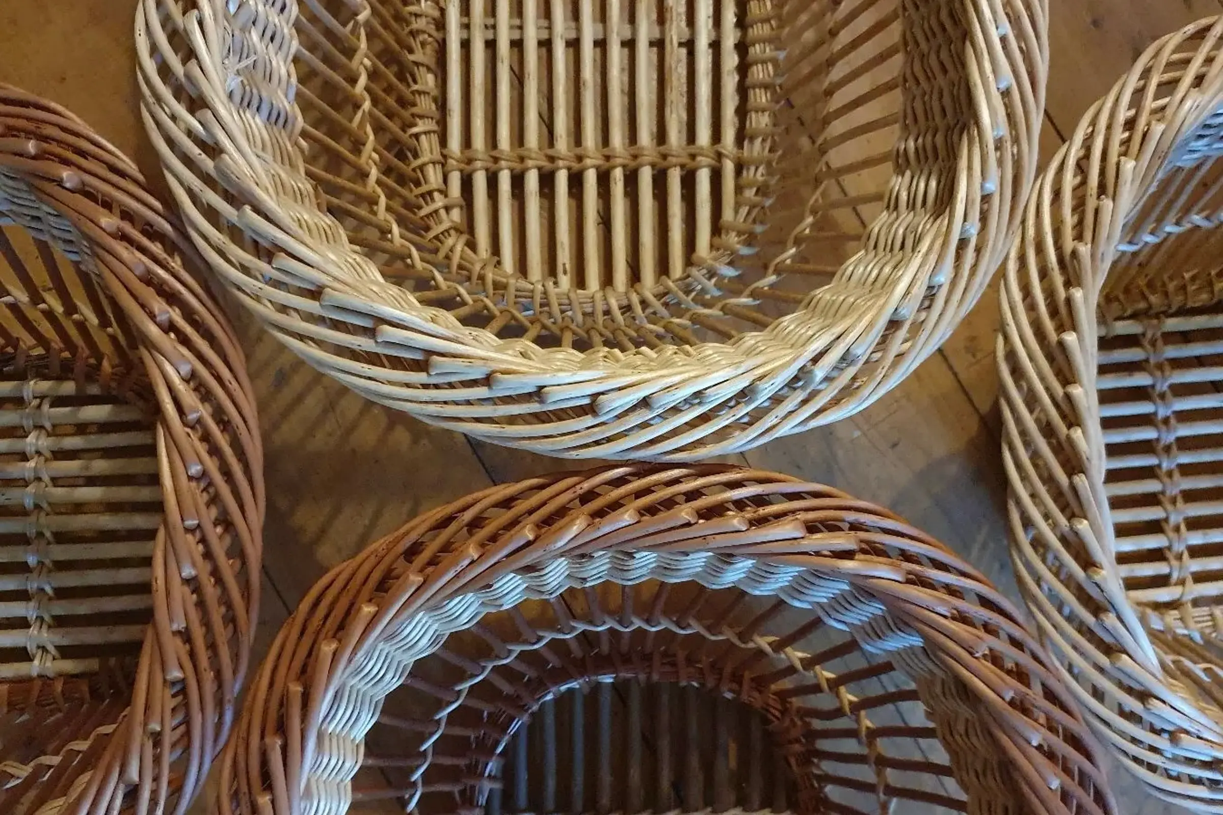 a collection of kitchen willow market baskets