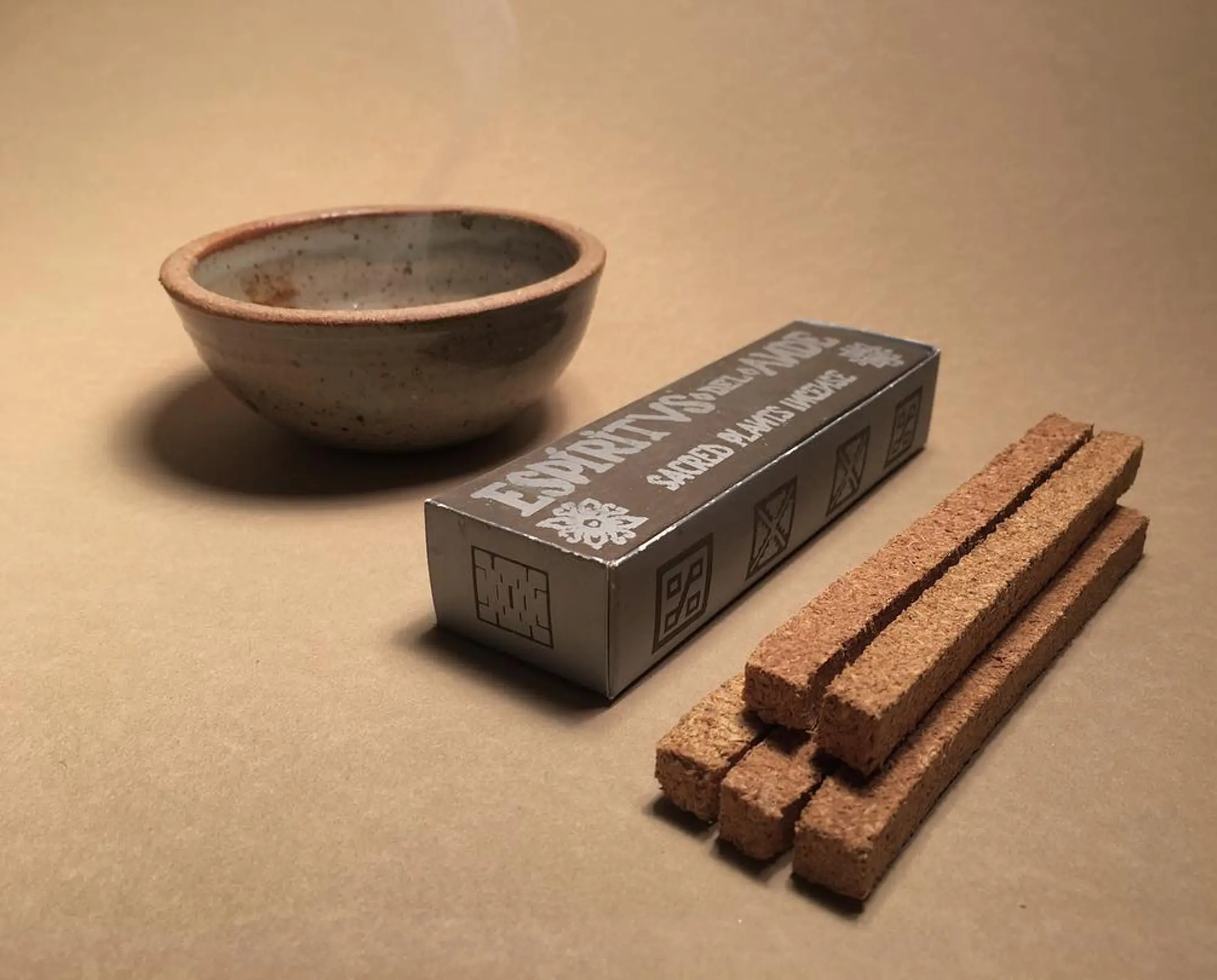Pure palo Santo incense bricks from Incausa on a beige background